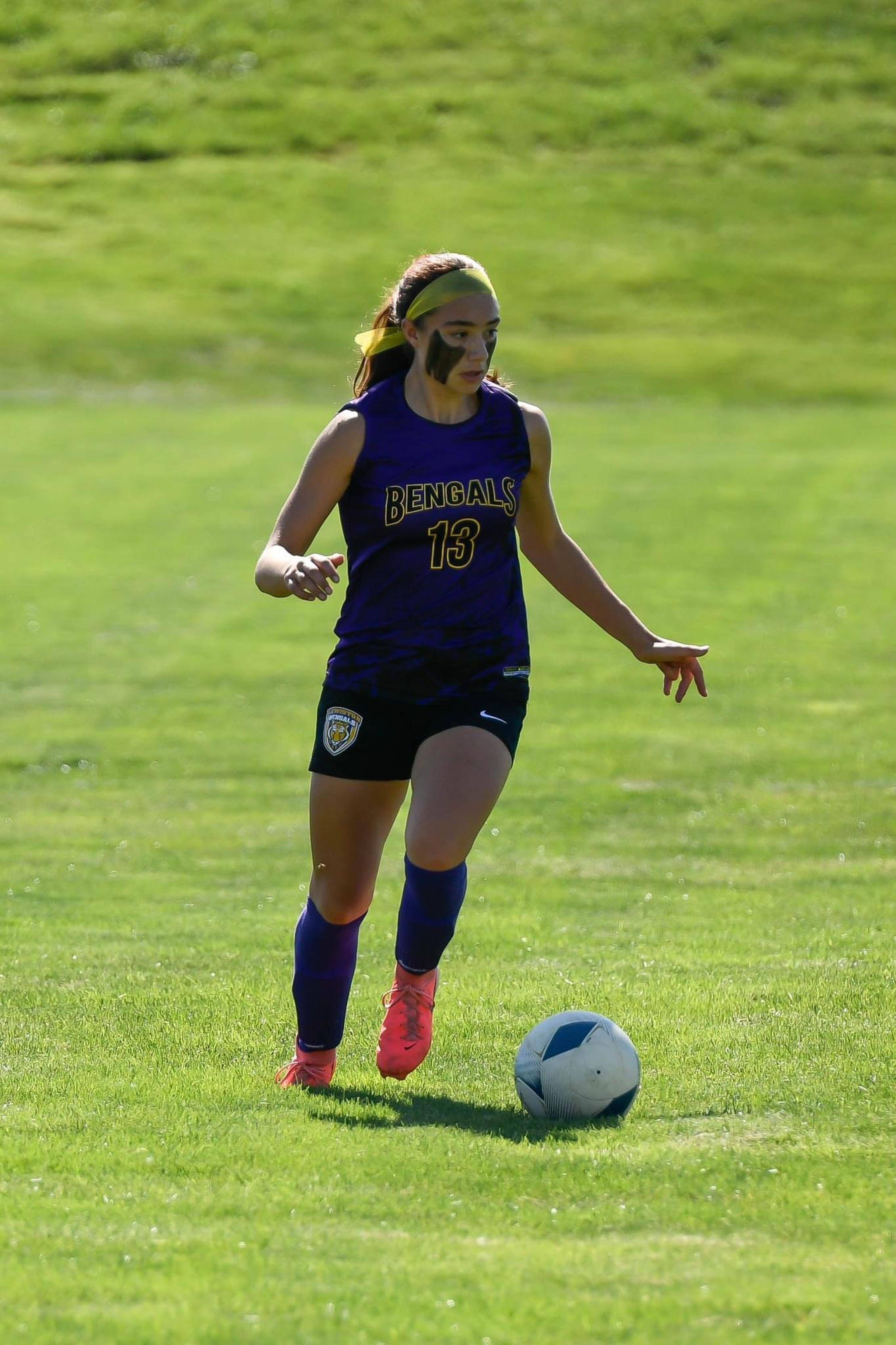 Trinity Bonebrake dribbles the ball in a Lewiston girls soccer game.