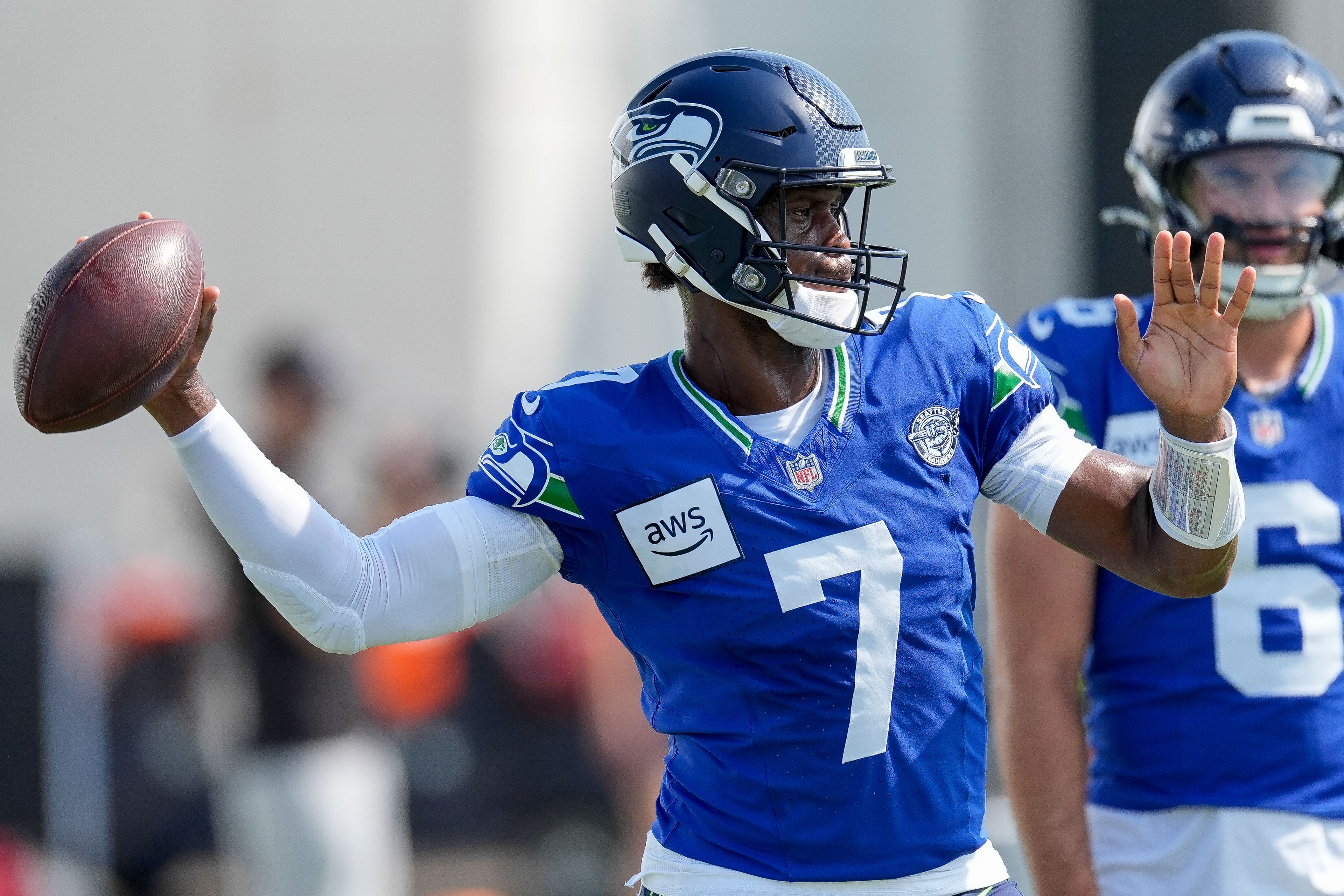 Seattle Seahawks quarterback Geno Smith (7) throws a pass during an NFL joint football training camp practice with the Tennessee Titans, Thursday, Aug. 15, 2024, in Nashville, Tenn. (AP Photo/George Walker IV)