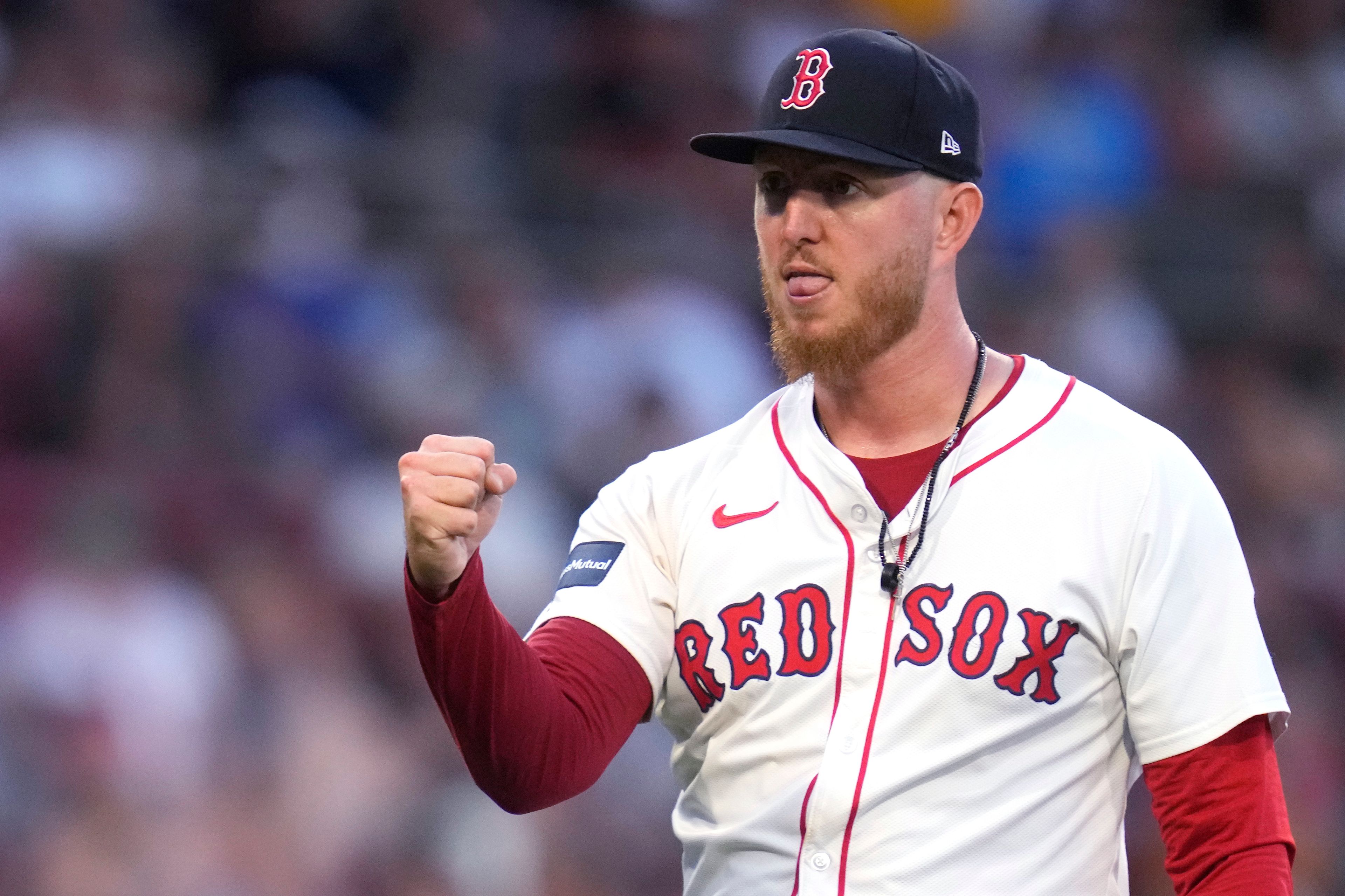 Boston Red Sox pitcher Zack Kelly pumps his fist after Seattle Mariners' Dylan Moore grounded out with bases loaded to end the top of the 10th inning of a baseball game, Wednesday, July 31, 2024, in Boston. (AP Photo/Charles Krupa)