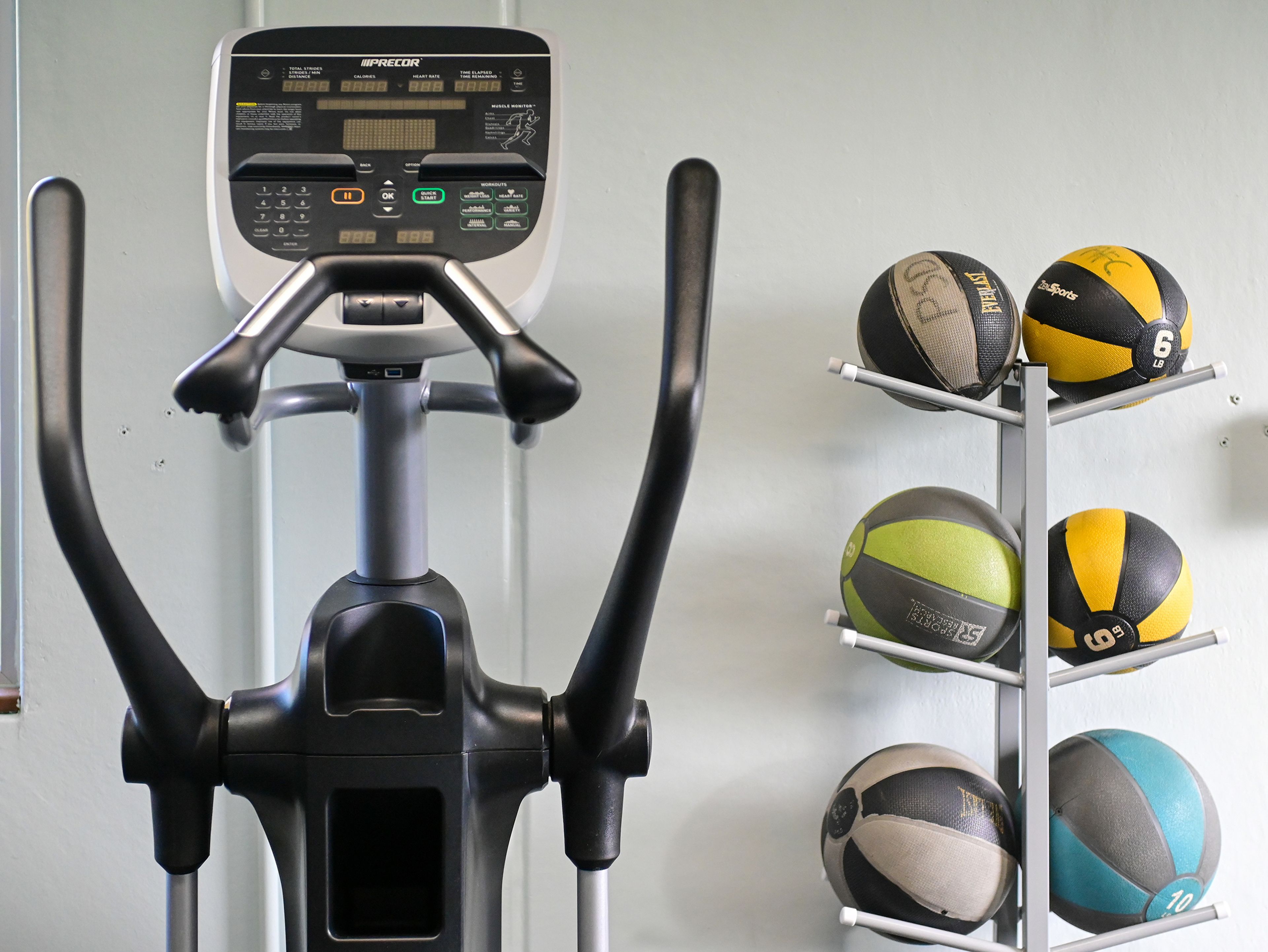 An elliptical machine and weighted balls sit in the fitness room Thursday at the Pullman Aquatic & Fitness Center.