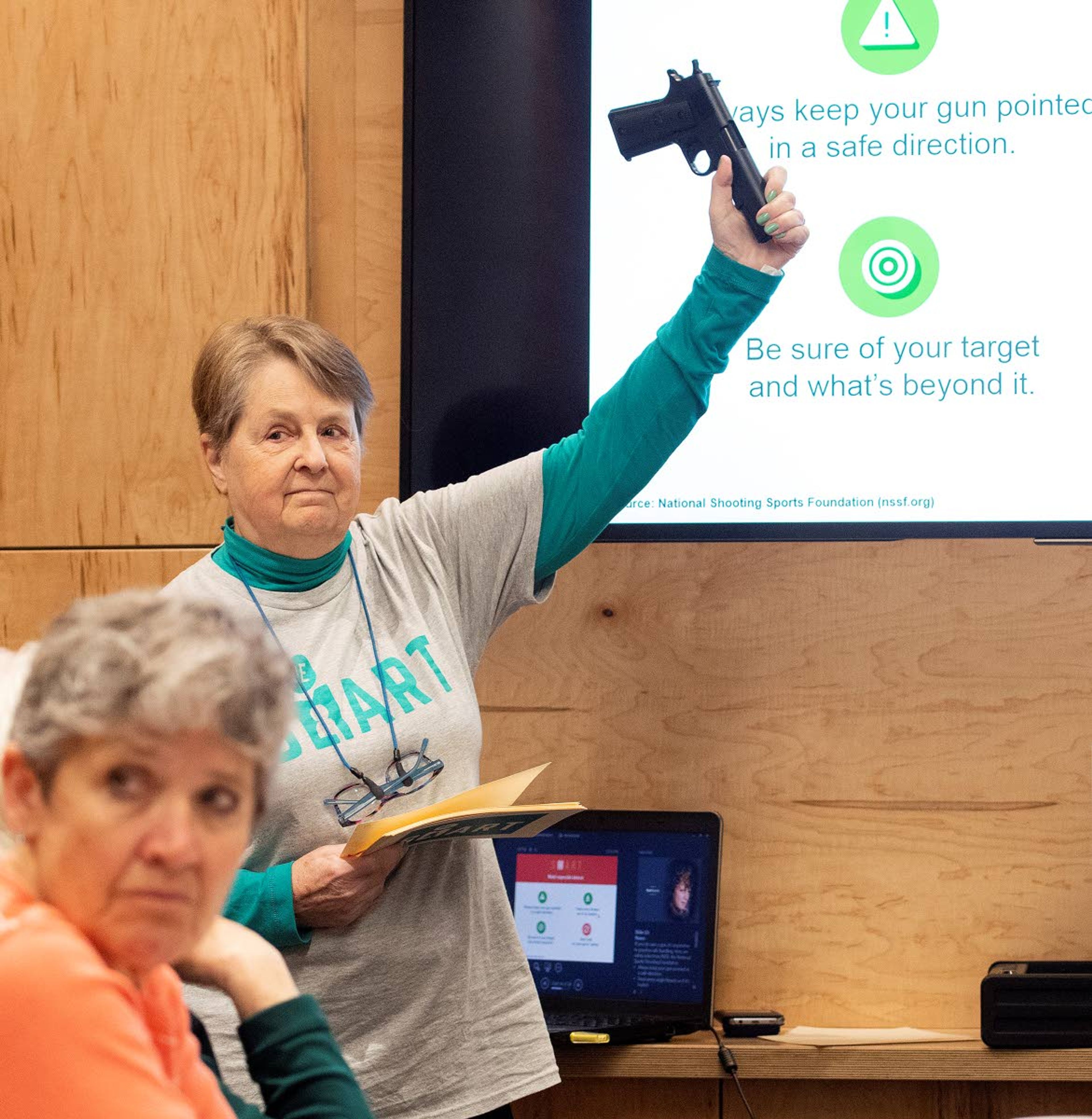 Marcia Banta of Lewiston holds up an air-pellet gun as she talks about gun safety during a presentation to the League of Women Voters of the L-C Valley on Wednesday afternoon at the Lewiston City Library. Banta was with a group called BeSmart, which teaches proper safety measures for gun owners who have children.