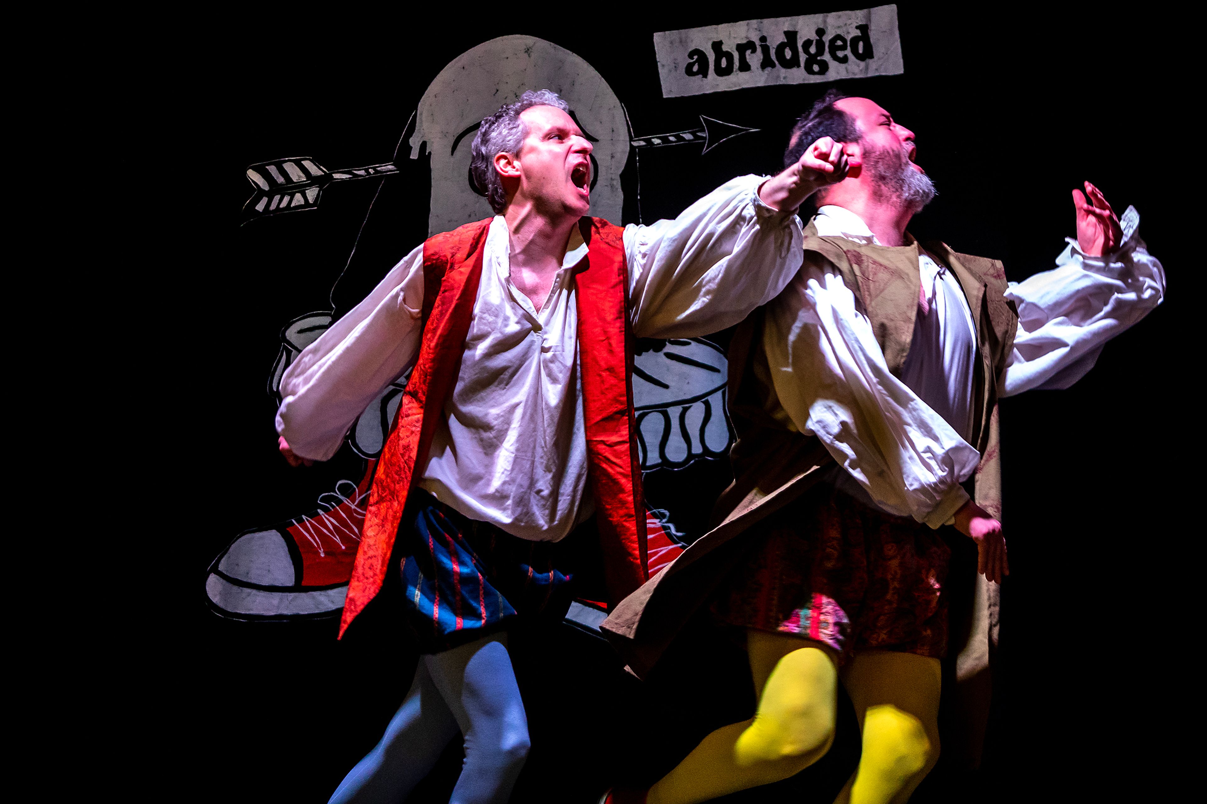 Travis Osburn delivers a punch to Jacob Trickey as they take on the roles of a Capulet and Montague during a rehearsal for “The Complete Works of William Shakespeare (Abridged)” Thursday last week at Lindsay Creek Vineyards in Lewiston.