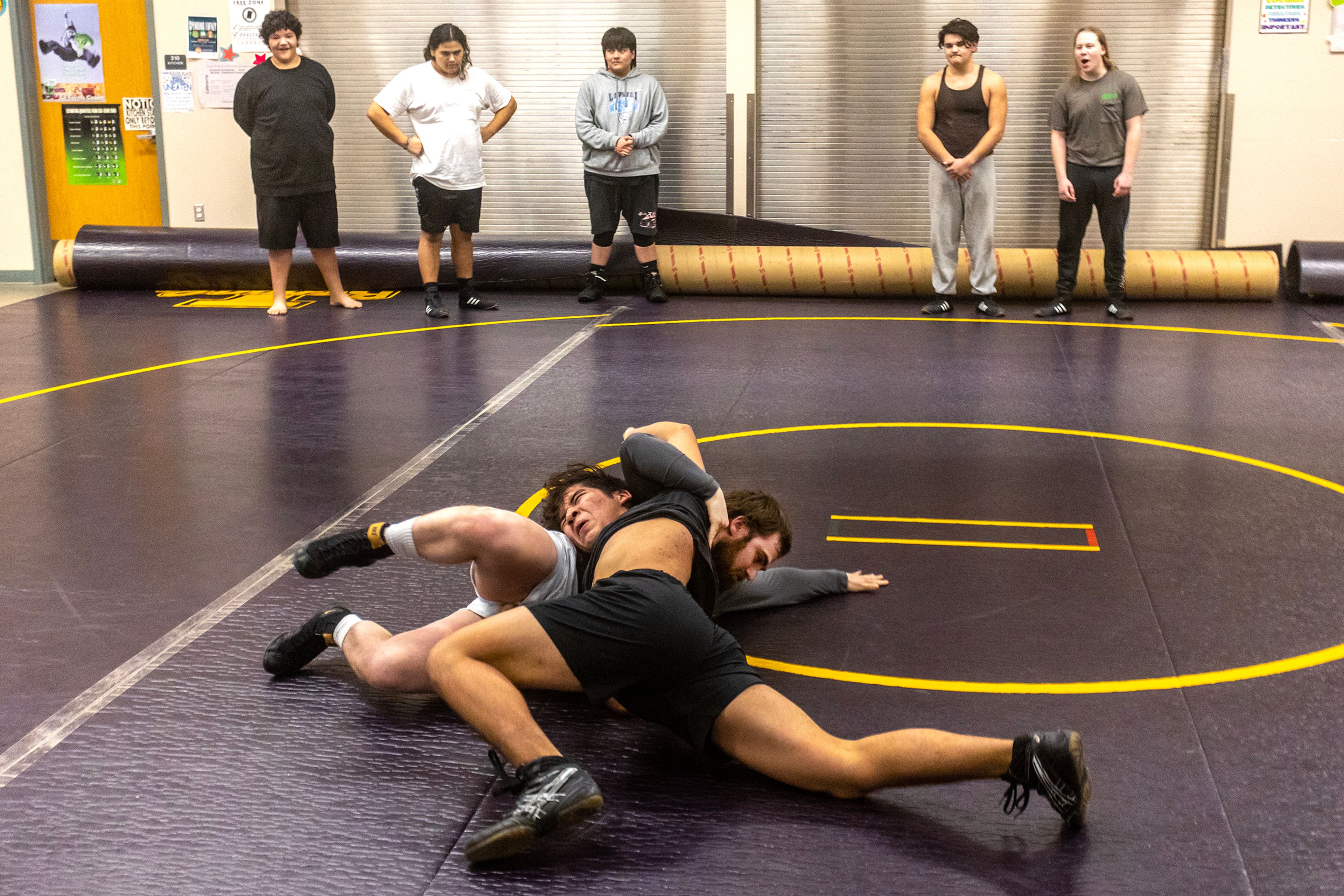 Leland Whitefoot wrestles with Lapwai coach Chris Katus, ultimately prevailing, during a Jan. 11 practice. For the first time in three decades, the Wildcats have a wrestling program.