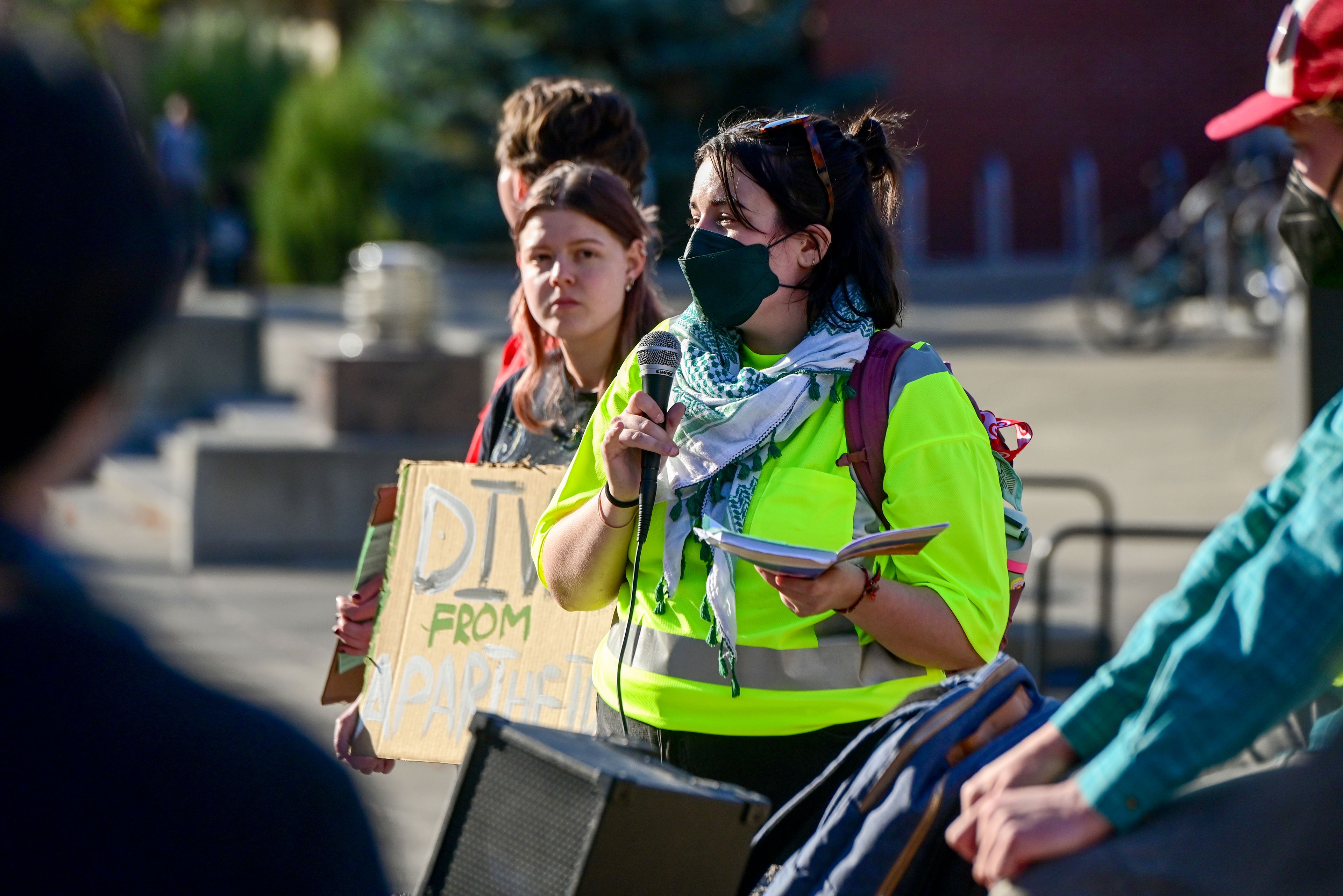 Leda Zakarison, center, speaks to a group gathered for a Pullman for Palestine rally on Washington State University campus Monday in Pullman.