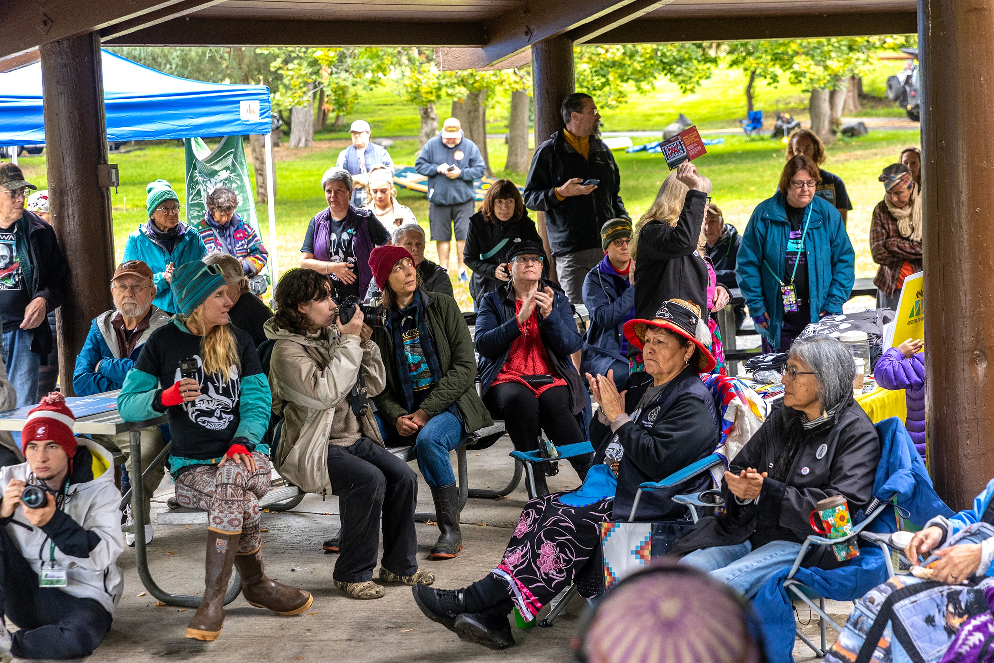 People listen to speakers during a demonstration calling for breaching the dams Saturday at Hells Gate State Park in Lewiston.