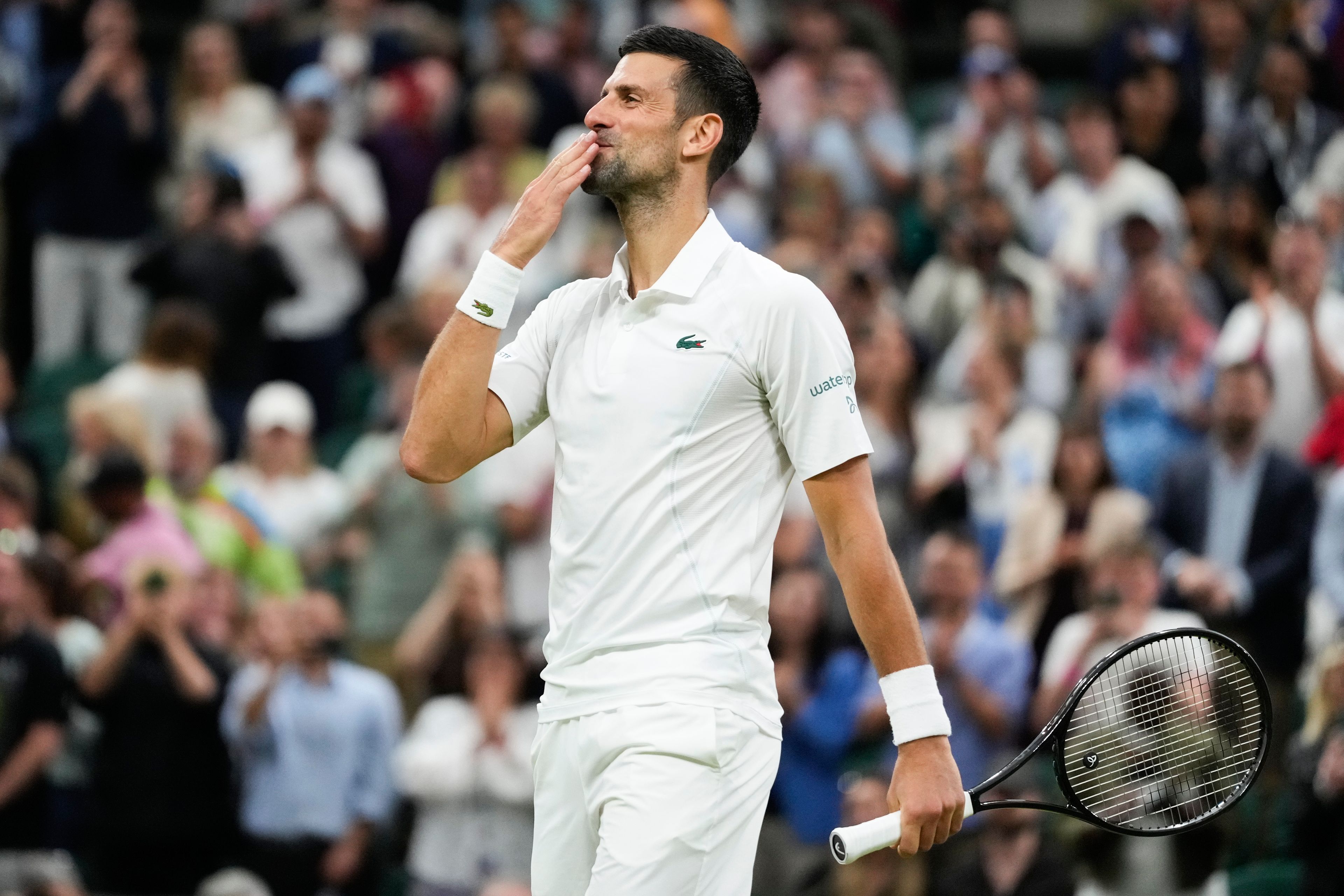 Novak Djokovic of Serbia celebrates after defeating Holger Rune of Denmark in their fourth round match at the Wimbledon tennis championships in London, Monday, July 8, 2024. (AP Photo/Kirsty Wigglesworth)