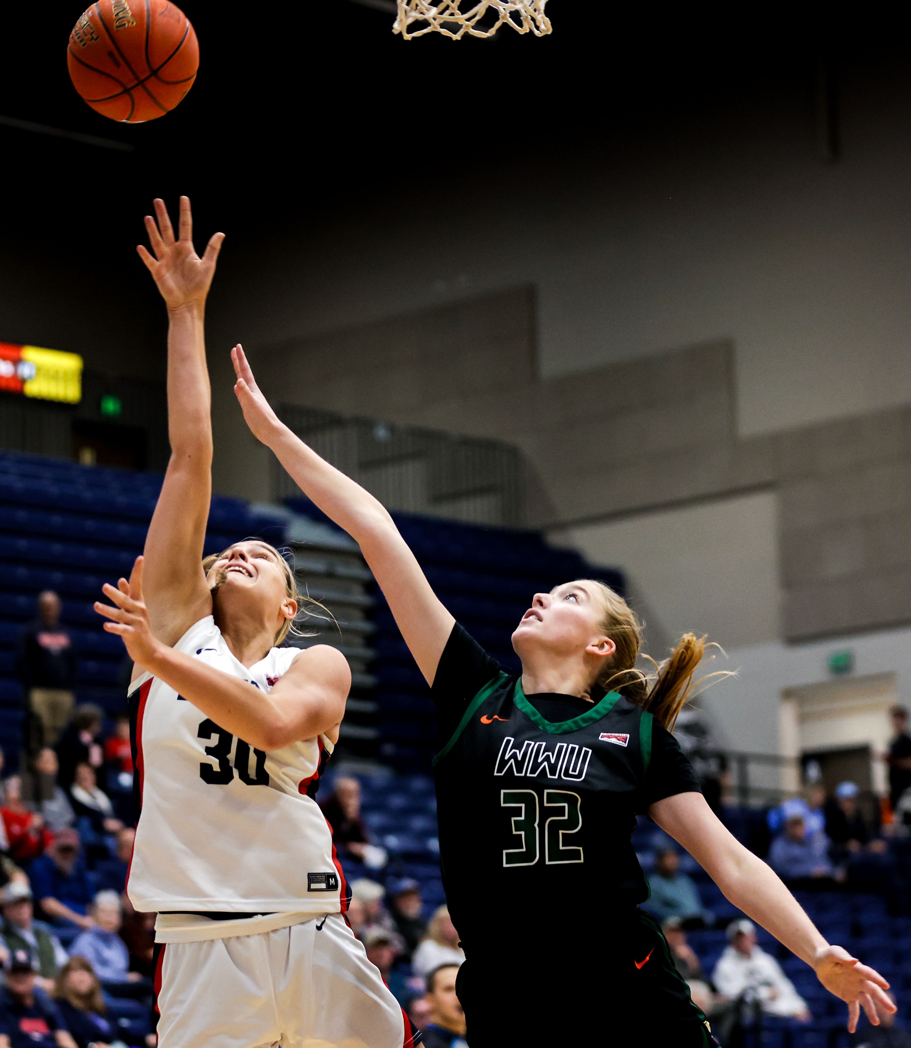 Lewis-Clark State forward Darian Herring shoots the ball as Walla Walla center Sidney Folkenberg guards her during a quarter of a Cascade Conference game Tuesday at Lewis-Clark State College in Lewiston.