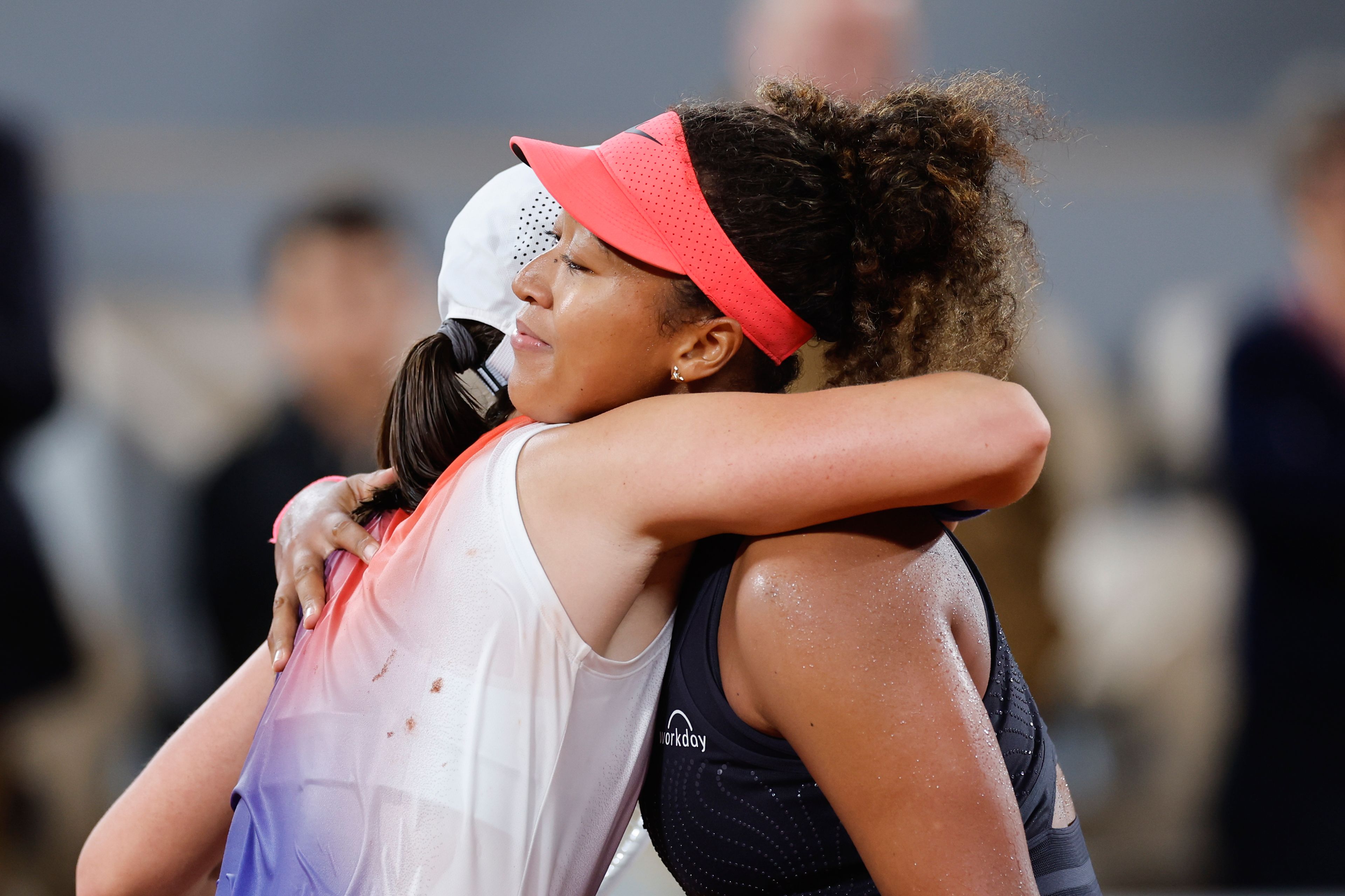 Japan's Naomi Osaka, right, congratulates Poland's Iga Swiatek with winning her second round match of the French Open tennis tournament at the Roland Garros stadium in Paris, Wednesday, May 29, 2024.