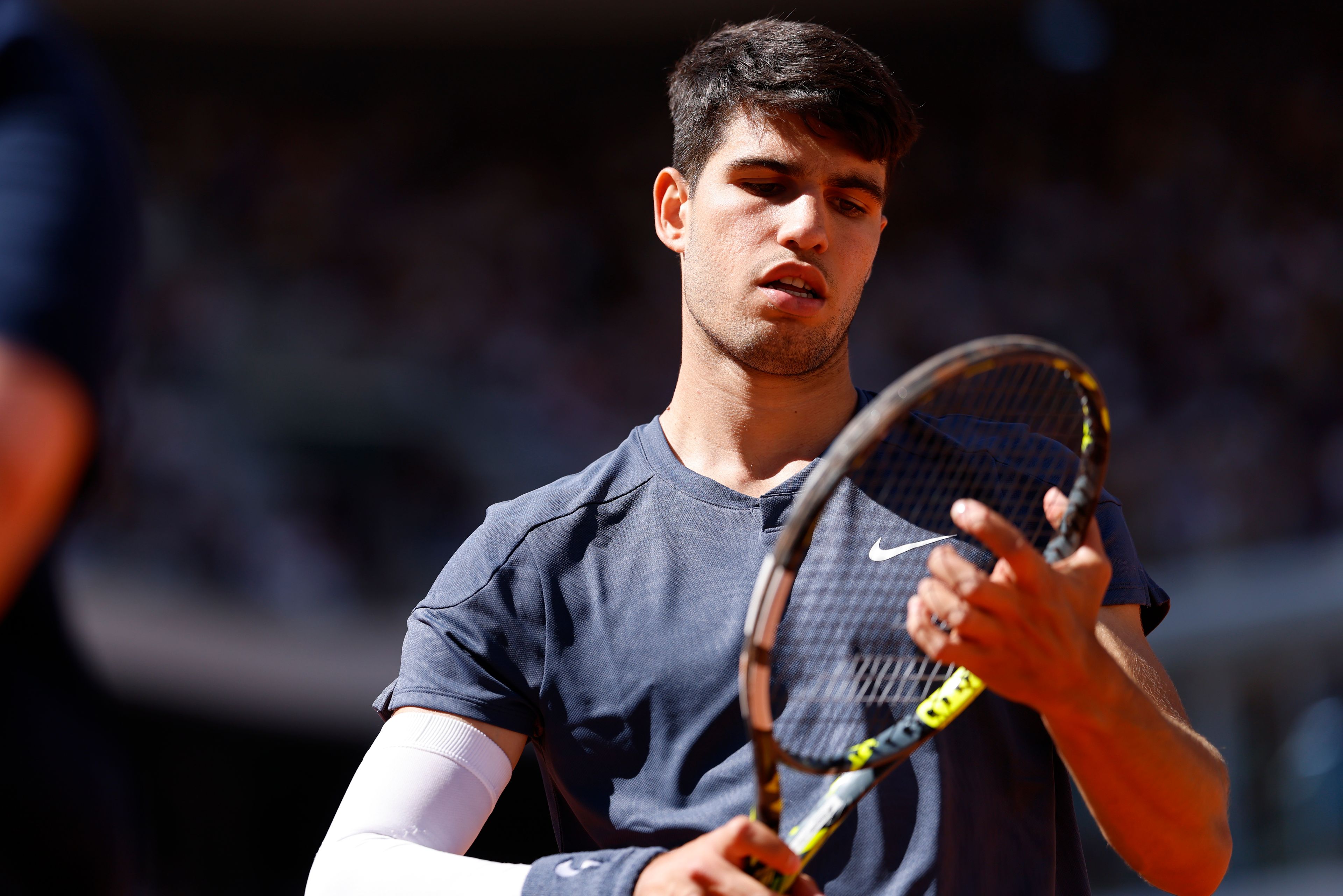 Spain's Carlos Alcaraz attends his semifinal match of the French Open tennis tournament against Italy's Jannik Sinner at the Roland Garros stadium in Paris, Friday, June 7, 2024.