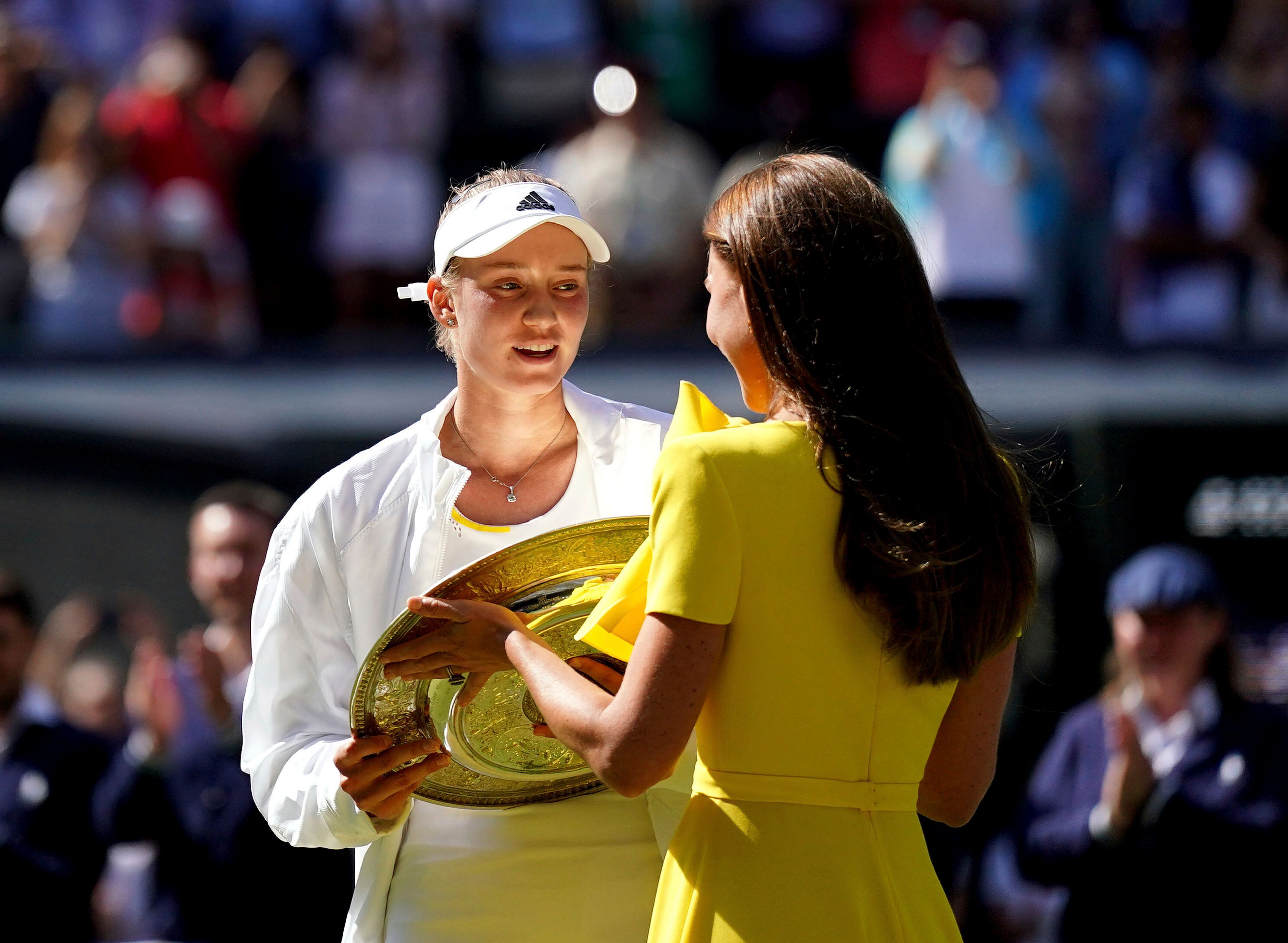 Kazakhstan’s Elena Rybakina is presented with the trophy by Kate, Duchess of Cambridge, after beating Tunisia’s Ons Jabeur to win women’s singles final at the Wimbledon championships Saturday in London.