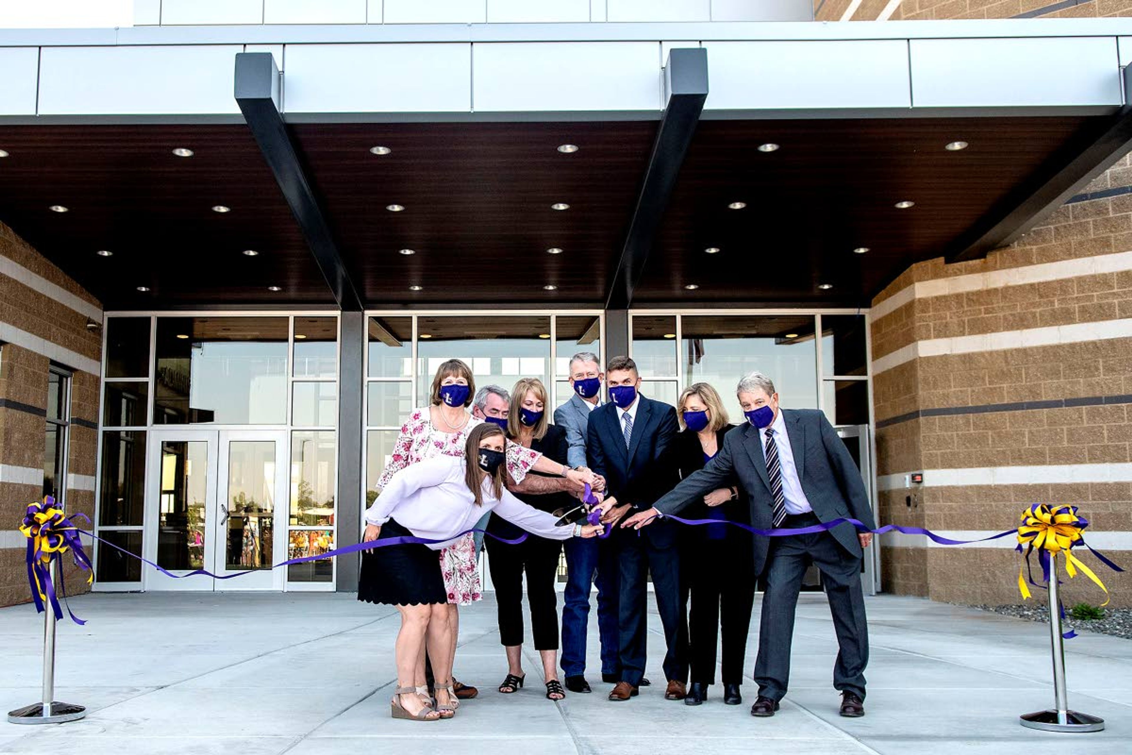 The ribbon is cut at the new Lewiston High School on Friday morning.