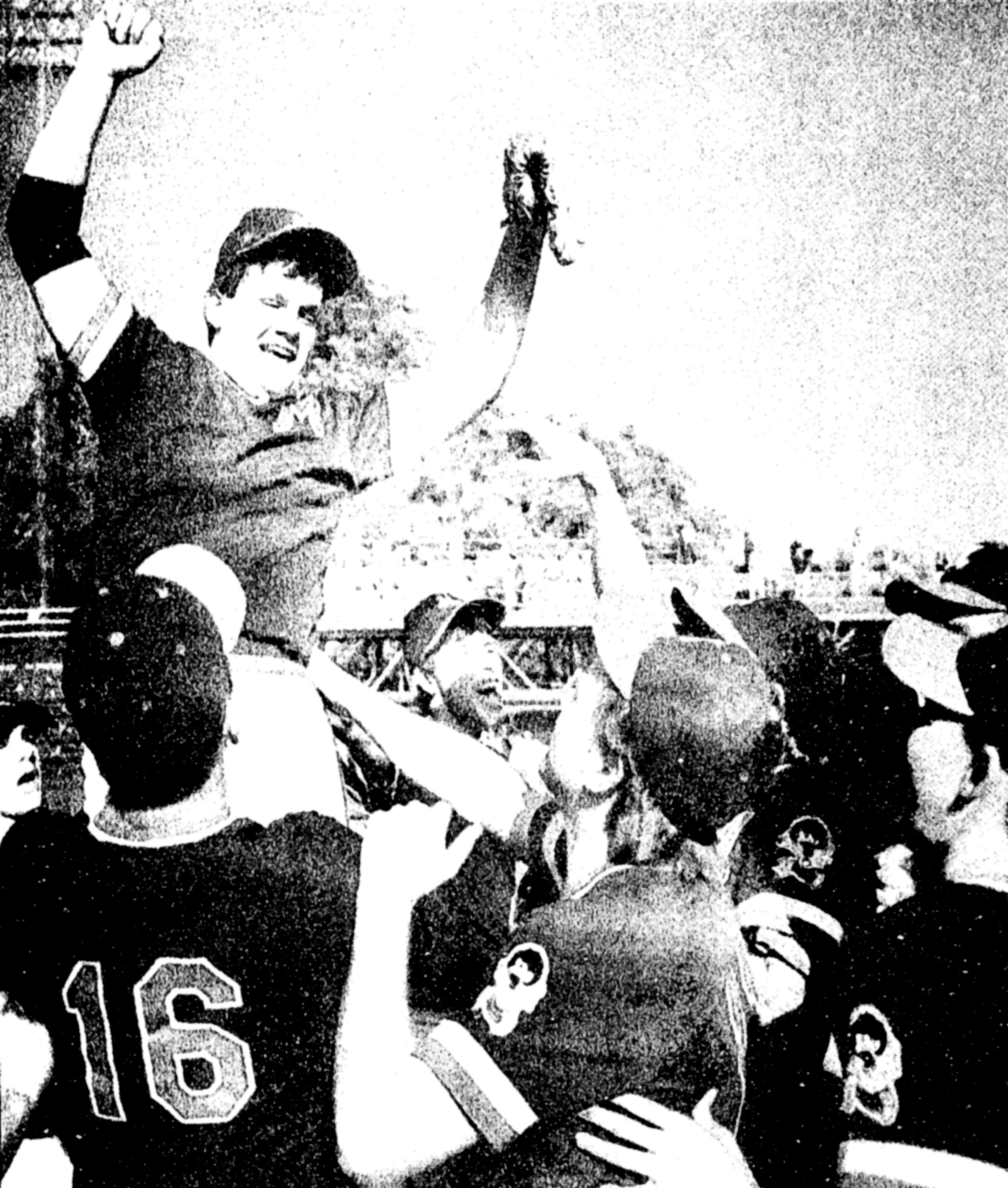 After striking out the last batter, Ray Fuentes is lifted up by his Orofino teammates. The Maniacs won the State A-3/A-4 baseball title Saturday at Harris Field. (Tribune/Jim Vollbrecht)