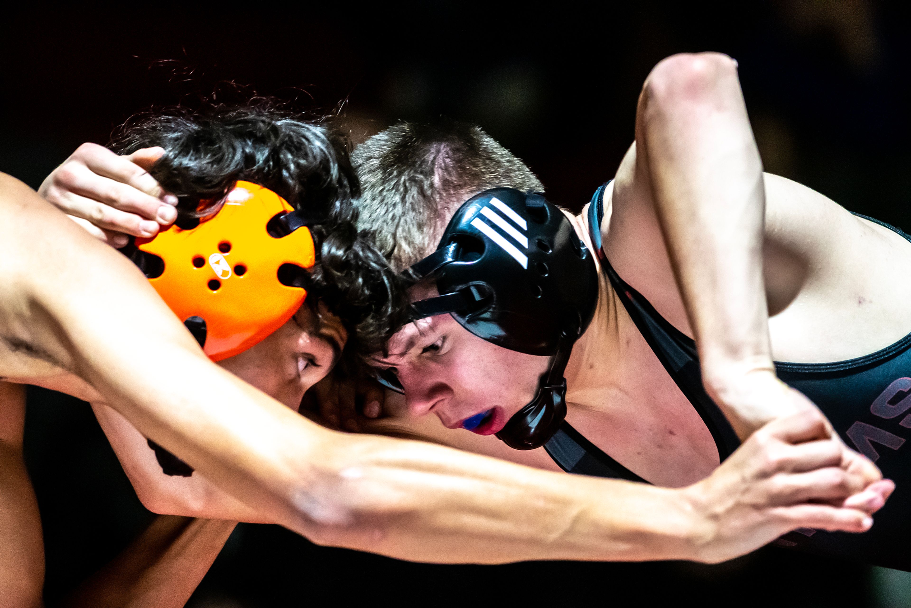 Clarkston’s Clayton Ockwell grapples with West Valley’s Jaiden Peak in the 126 pound weight class match during a wrestling duel Wednesday at Clarkston.