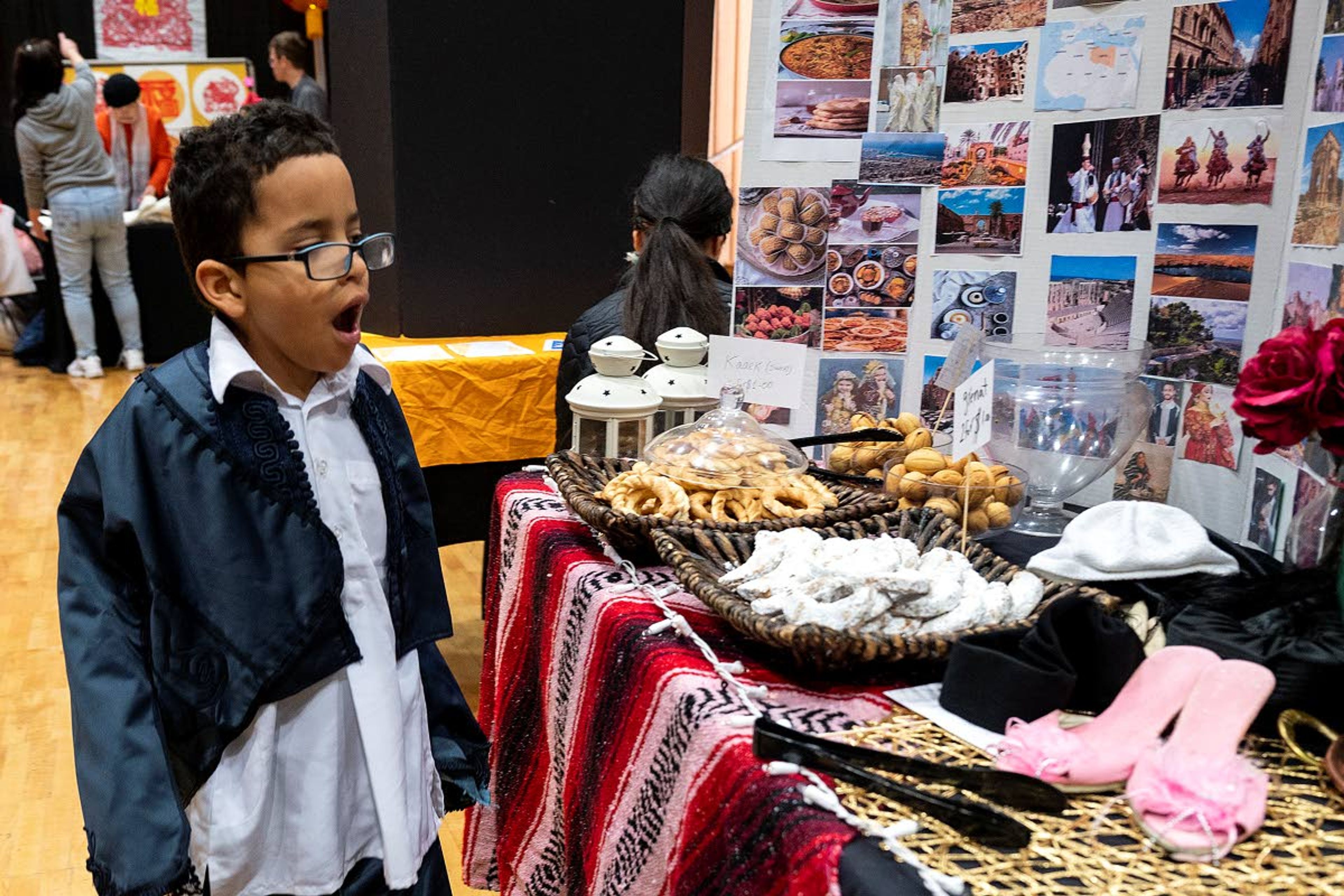 Ahmed Abdussamad, 7, gasps at the enticing Turkish pastries for sale that were adjacent to the booth his mother was at which was serving up delicious Libyan food during the University of Idaho’s Cruise the World event on Saturday afternoon at the Pitman Center in Moscow.