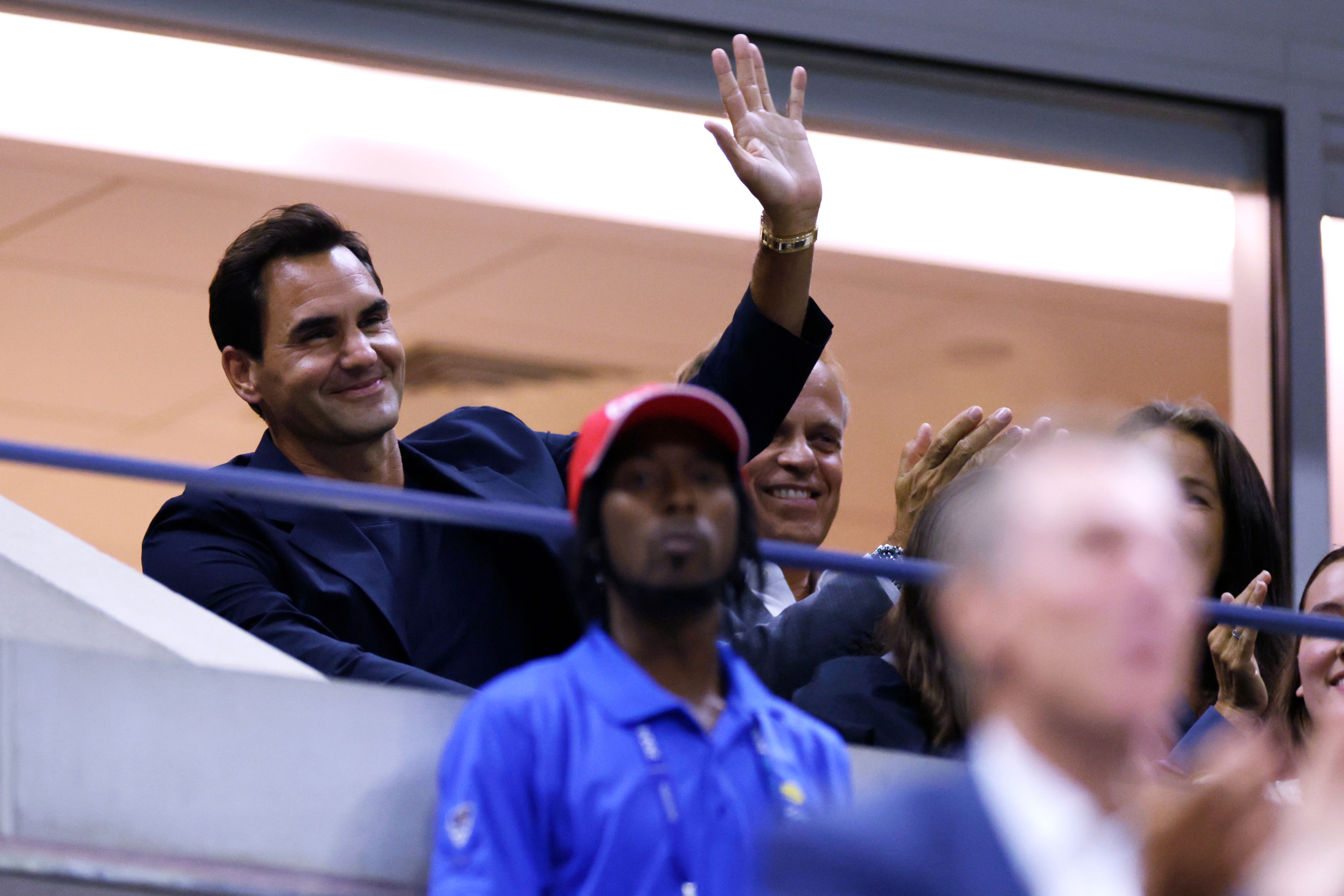 Tennis great Roger Federer waves to the crowd during the quarterfinal match between Aryna Sabalenka, of Belarus, and Zheng Qinwen, of China, during the U.S. Open tennis championships, Tuesday, Sept. 3, 2024, in New York.