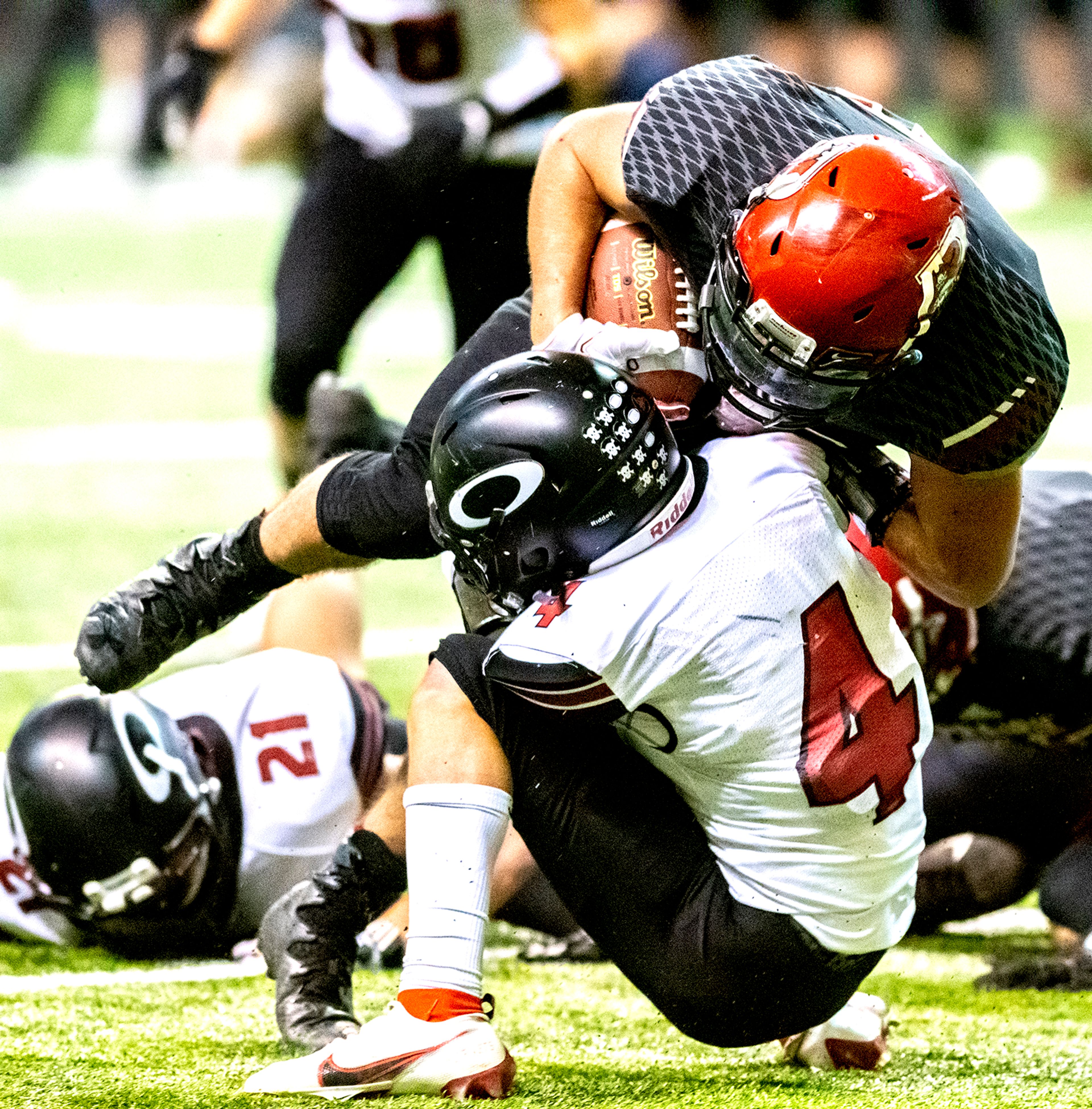 Prairie’s Brody Hasselstrom is stopped by Oakley’s Austin Cranney. The Prairie Pirates lost to the Oakley Hornets 42-40 in the Class 1A Division O state semifinal football game at the Kibbie Dome in Moscow on Friday.