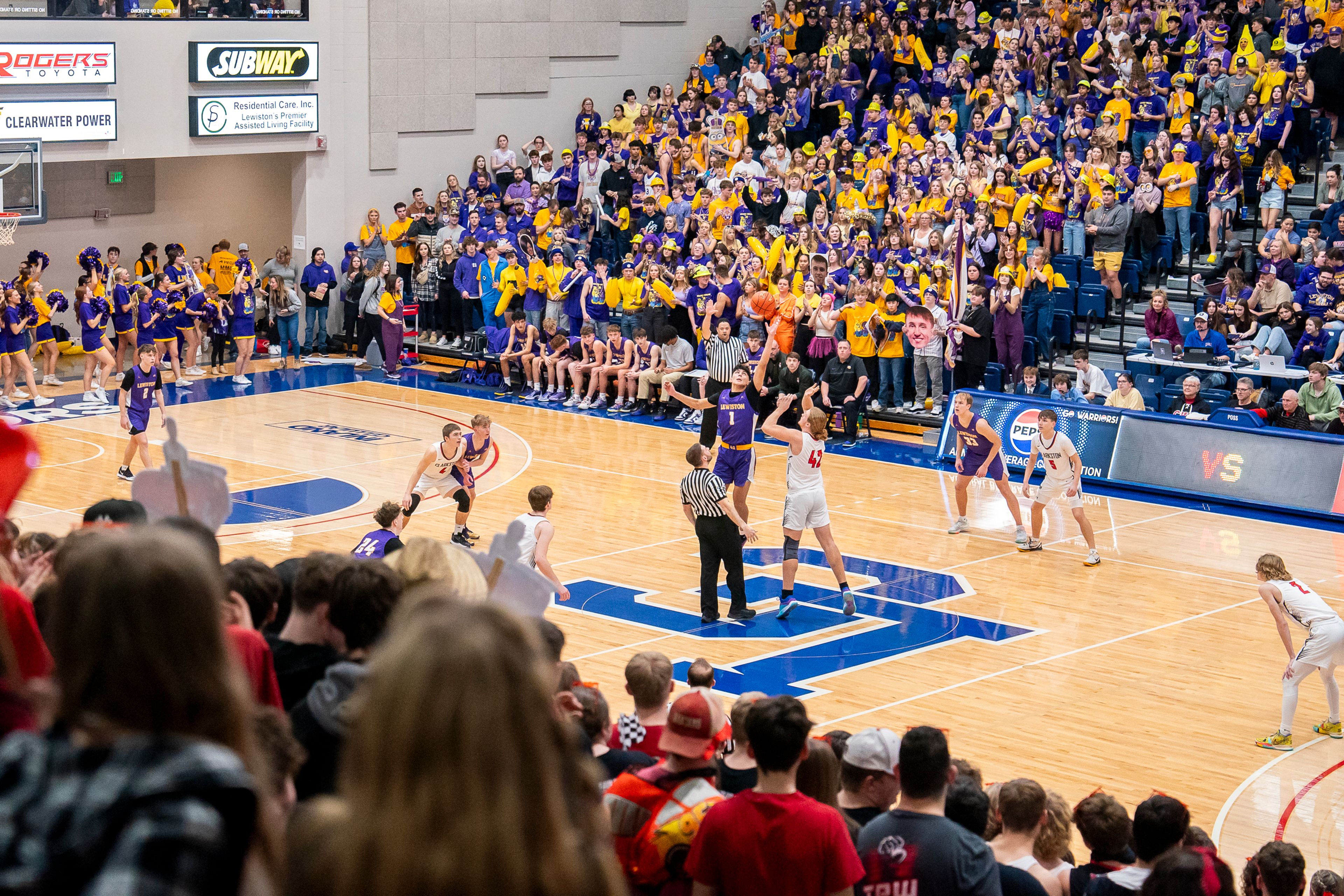 Lewiston’s Rylan Gomez (1) wins the jump-ball during their Golden Throne rivalry game against Clarkston on Friday inside the P1FCU Activity Center in Lewiston.