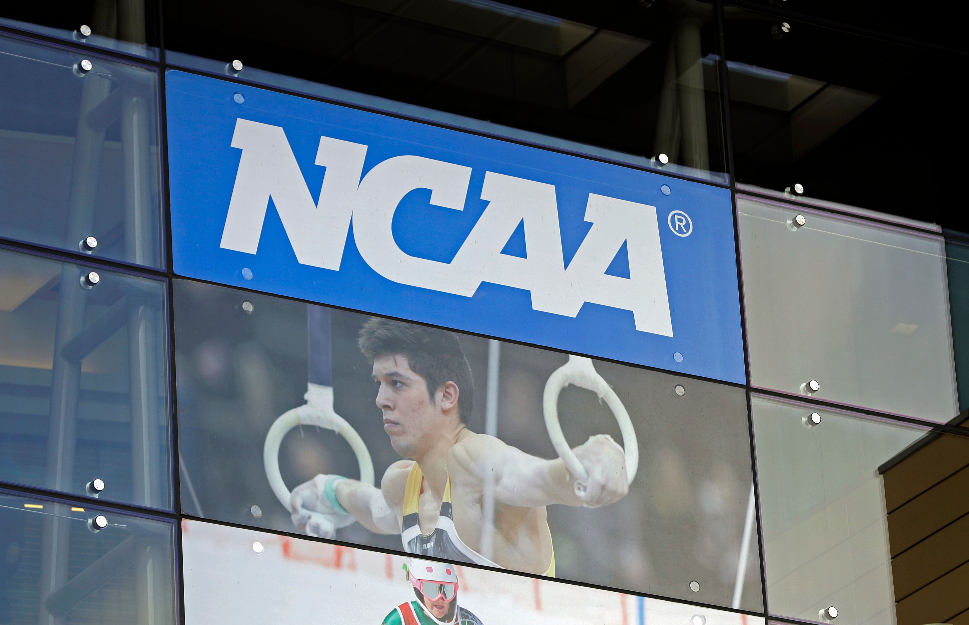 FILE - In this April 25, 2018, file photo, the NCAA headquarters is shown in Indianapolis. University presidents around the country are scheduled to meet this week in May 2024, to vote on whether to accept a proposed settlement of an antitrust lawsuit that would cost the NCAA nearly $3 billion in damages.