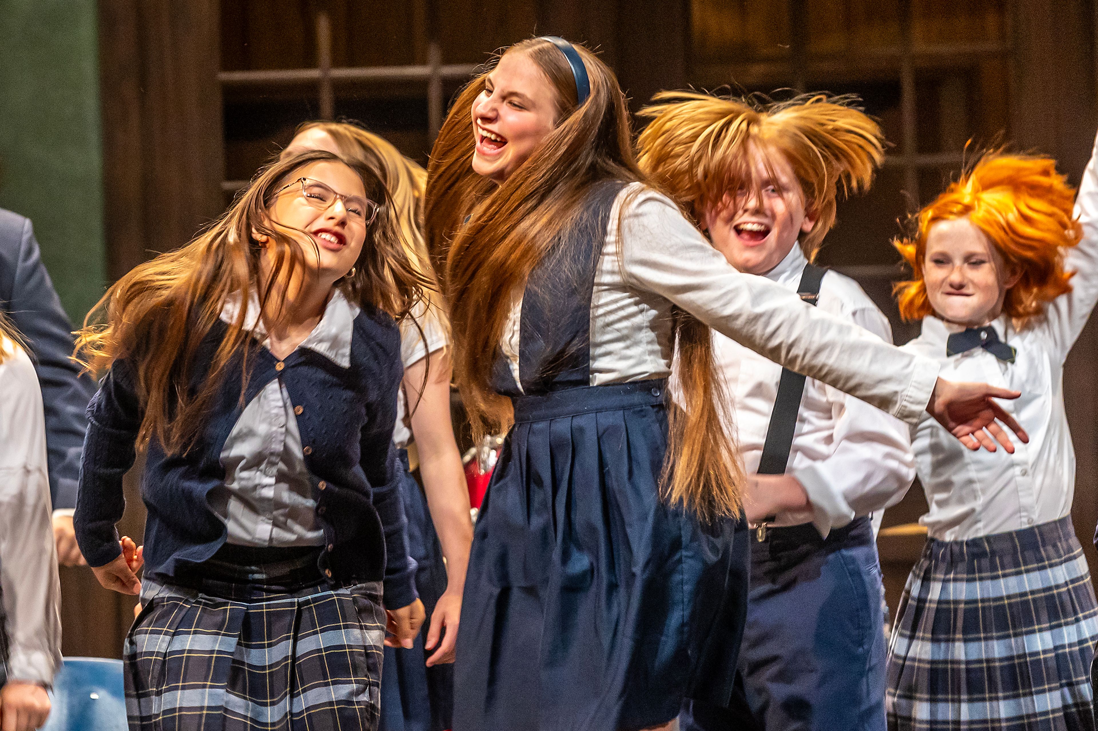 Brynley Comer, from left, plays Madison, Lila Heinzerling plays Summer, Alton Pittenger playing Billy, and Izzie Brinegar plays Shonelle as they dance during a rehearsal for the Civic Theatre production of School of Rock Tuesday, May 21, in Lewiston.