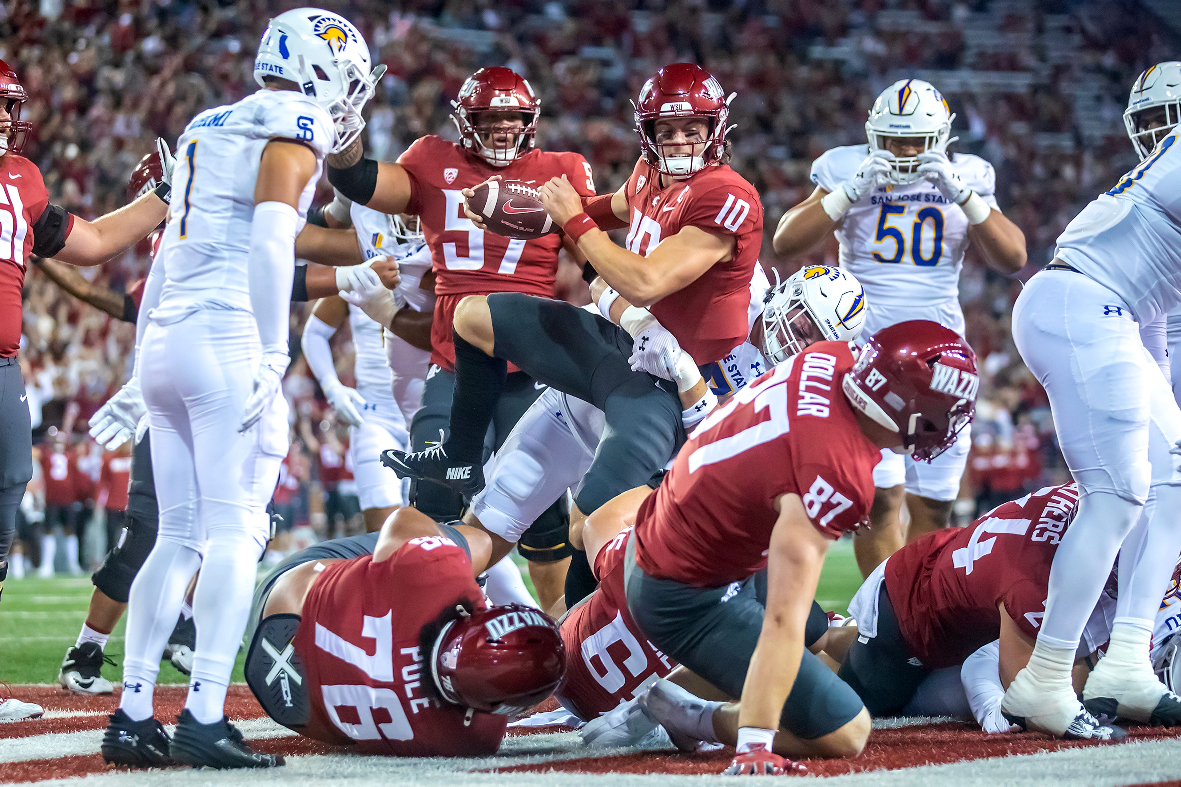 Washington State quarterback John Mateer gets into the end zone in a pile of bodies for a touchdown against San Jose State during a game Friday, Sept. 20, at Gesa Field in Pullman.,