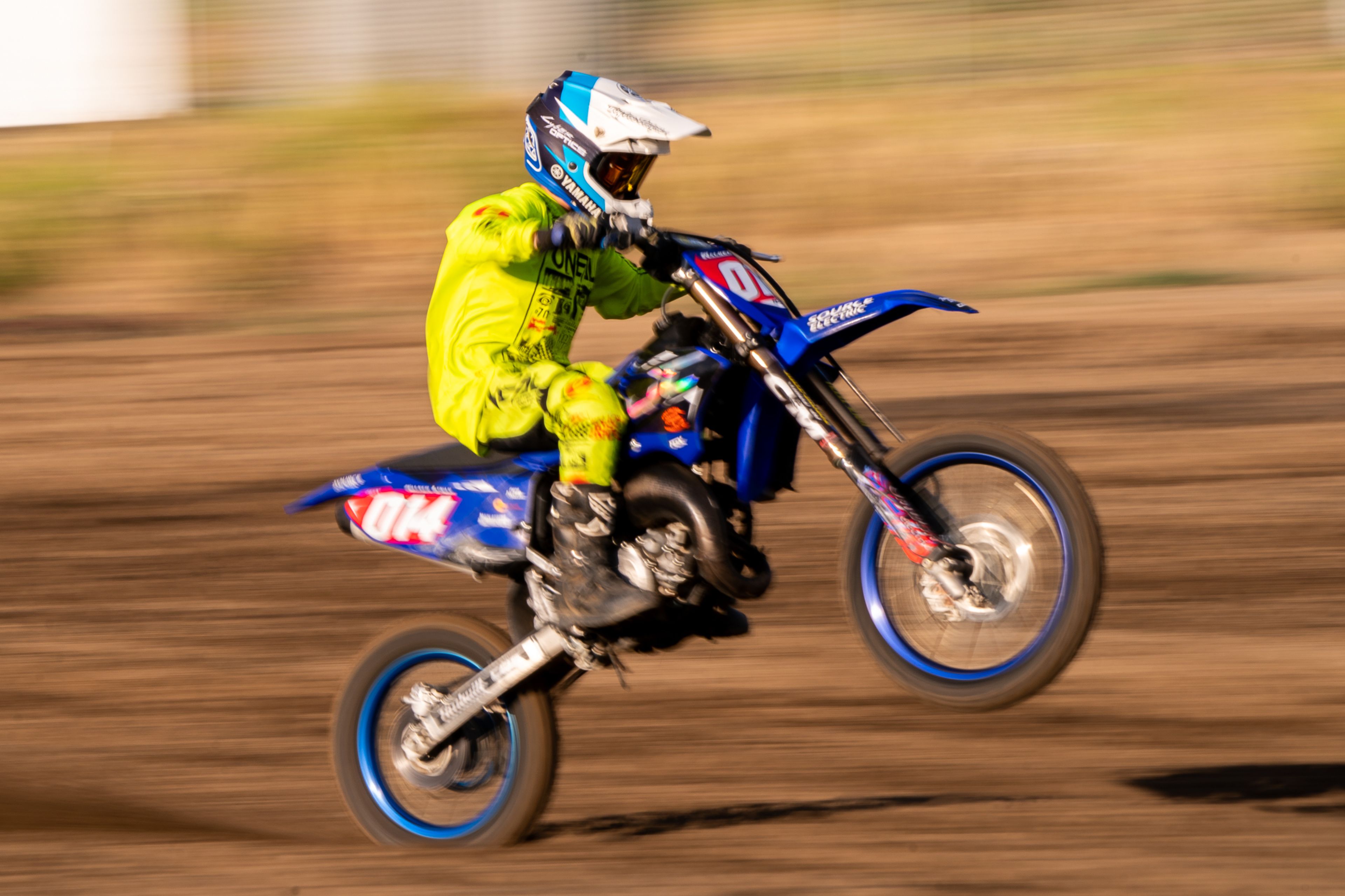 Walker Lynas hits a wheelie as rides through the final straightaway during the Horsepower vs Horse Power event Saturday evening at ECMX Park in Lewiston.