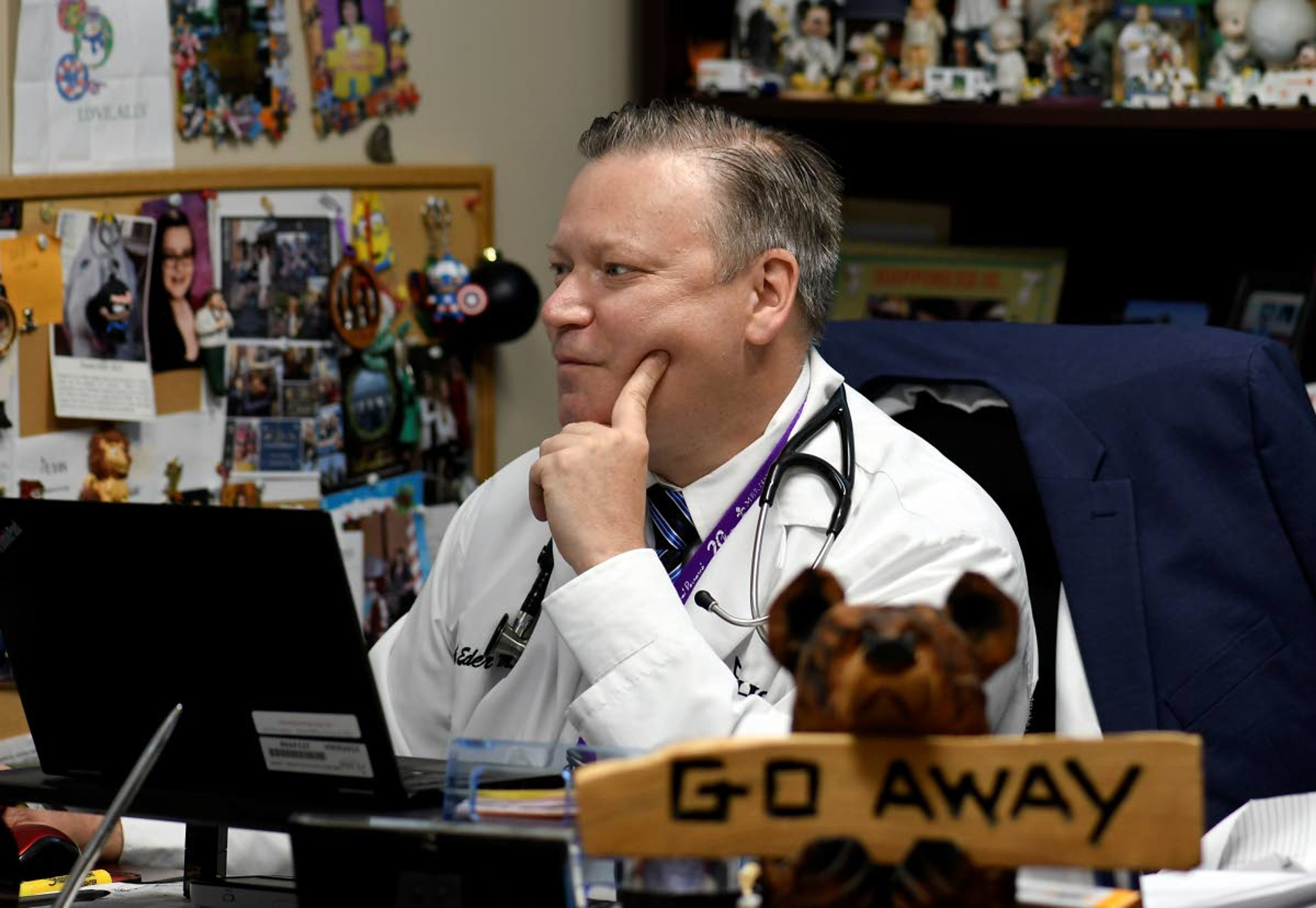 Dr. Frank Eder works in his office as the world's biggest study of a possible COVID-19 vaccine, developed by the National Institutes of Health and Moderna Inc., gets underway Monday, July 27, 2020, in Binghamton, N.Y. (AP Photo/Hans Pennink)