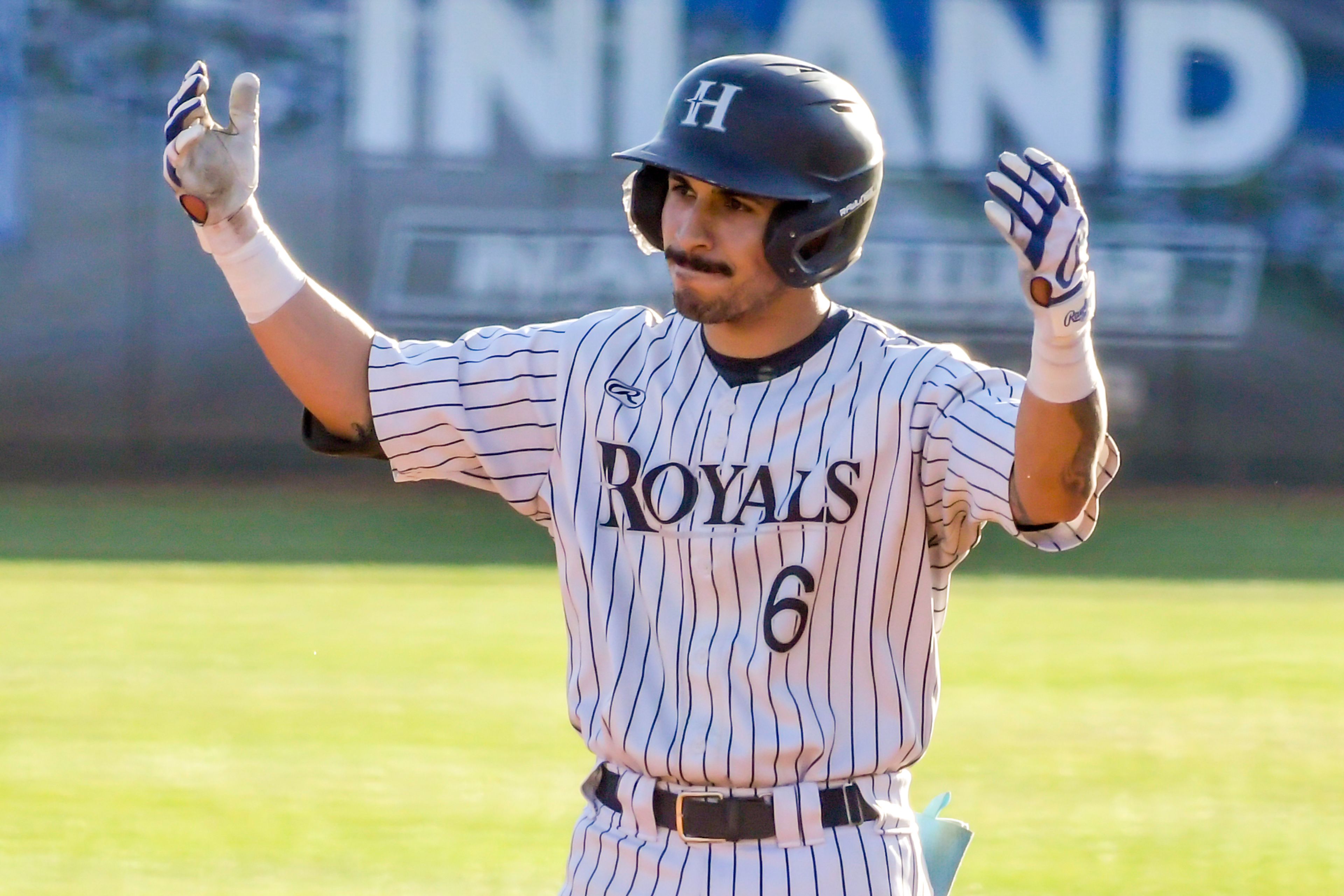 Hope International’s Alex Moreno reacts as he gets on first base against Tennessee Wesleyan in Game 19 of the NAIA World Series at Harris Field Friday in Lewiston.