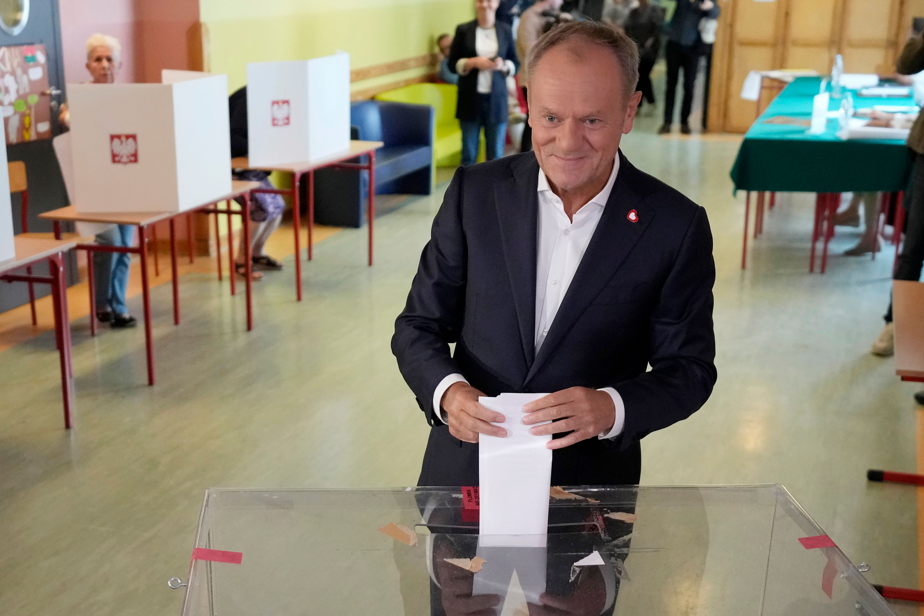 Polish Prime Minister Donald Tusk, who leads a centrist, pro-EU party, votes in the election for the European Parliament, in Warsaw, Poland, on Sunday June 9, 2024. Polling stations have opened across Europe as voters from 20 countries cast ballots in elections that are expected to shift the European Union’s parliament to the right and could reshape the future direction of the world’s biggest trading bloc.