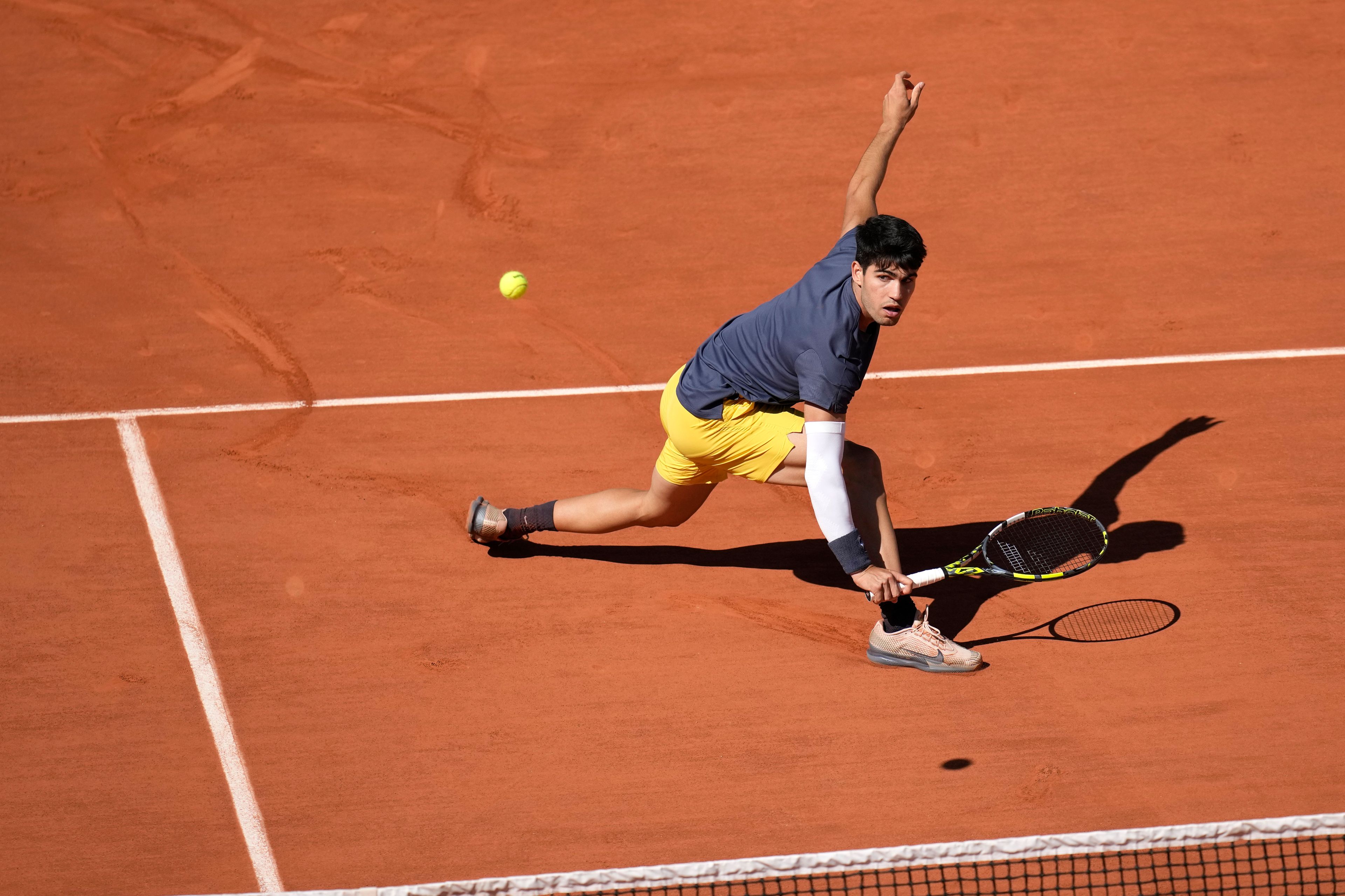 Spain's Carlos Alcaraz plays a shot against Italy's Jannik Sinner during their semifinal match of the French Open tennis tournament at the Roland Garros stadium in Paris, Friday, June 7, 2024.