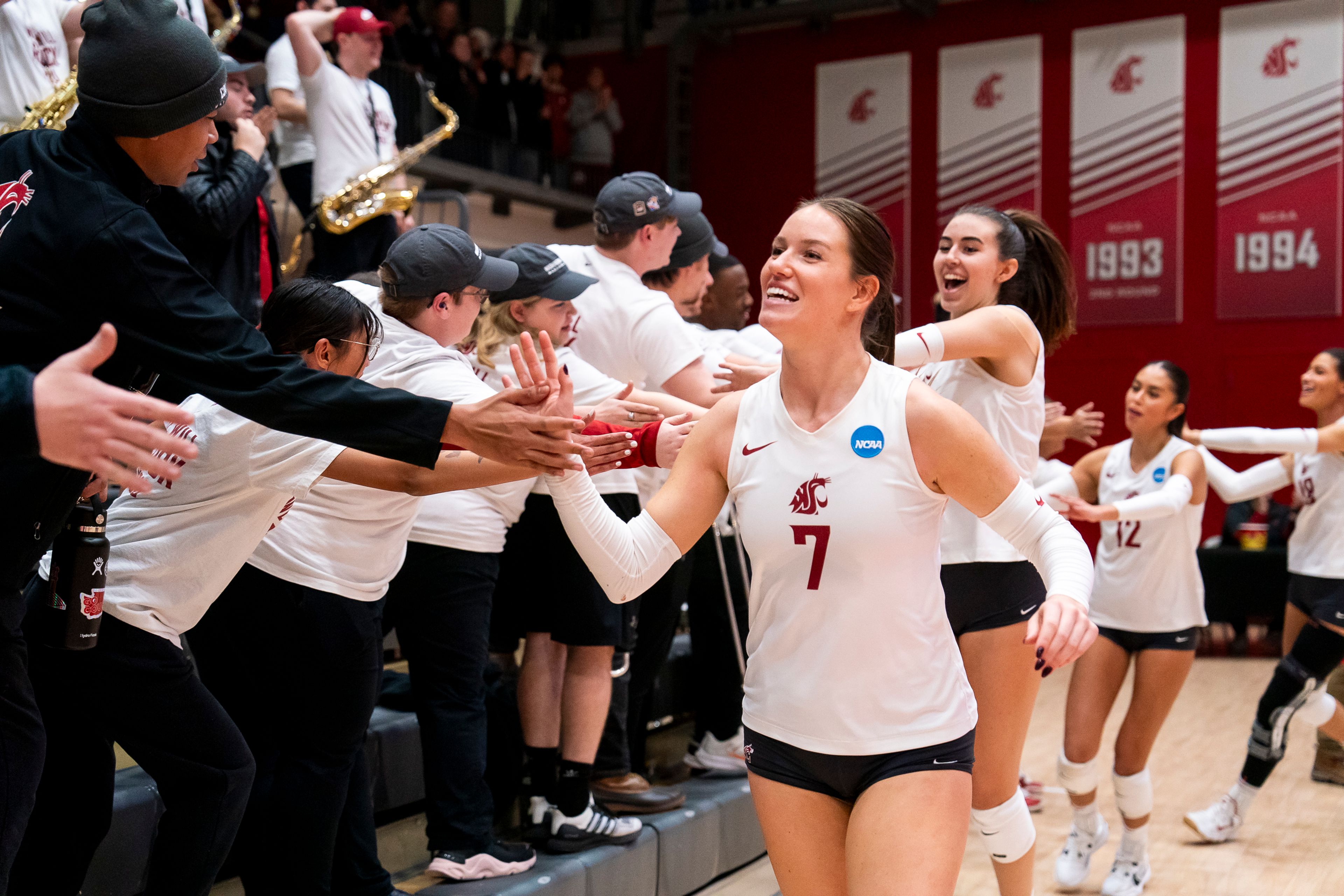 Washington State’s Pia Timmer (7) high-fives fans after winning a match against Grand Canyon University in the first round of the Division I NCAA Volleyball Tournament Friday at Bohler Gym in Pullman.