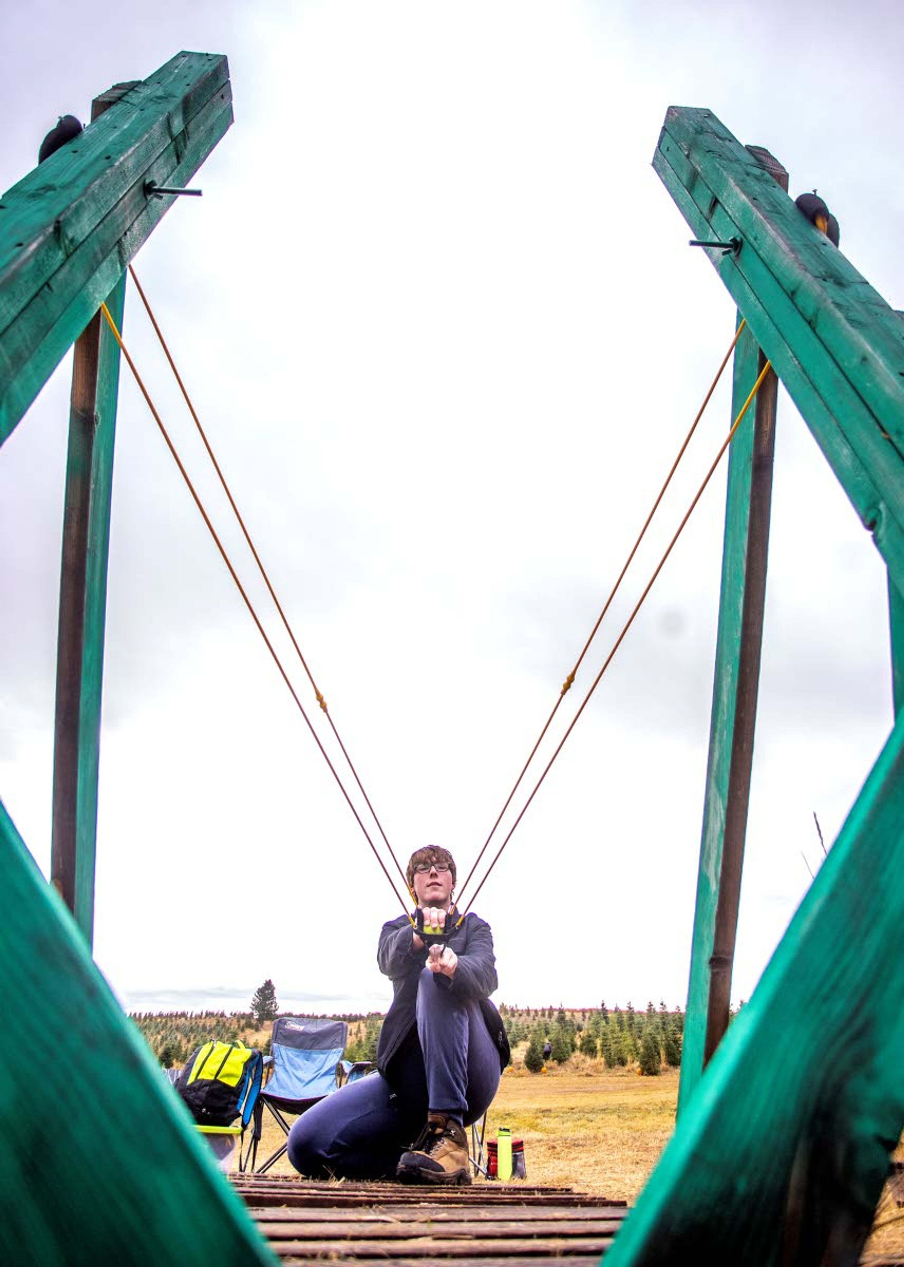 Brodie Ownbey, of Moscow, prepares to take the giant slingshot for a test run at the 6th annual Spring Valley Tree Farm Pumpkin Hunt outside Troy on Saturday.