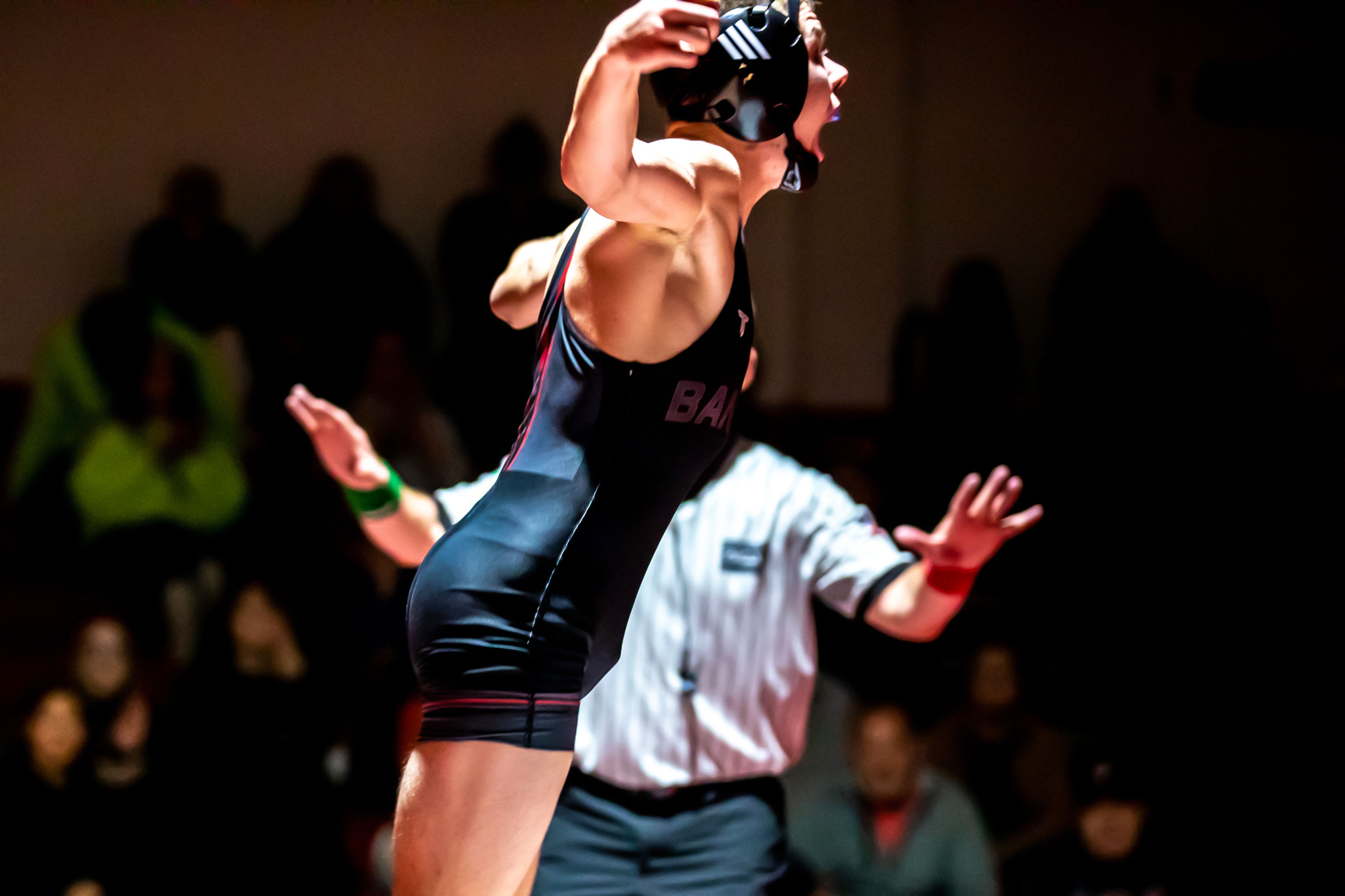 Clarkston’s Clayton Ockwell leaps up with a yell after defeating Jaiden Peak in the 126 pound weight class match during a wrestling duel Wednesday at Clarkston.