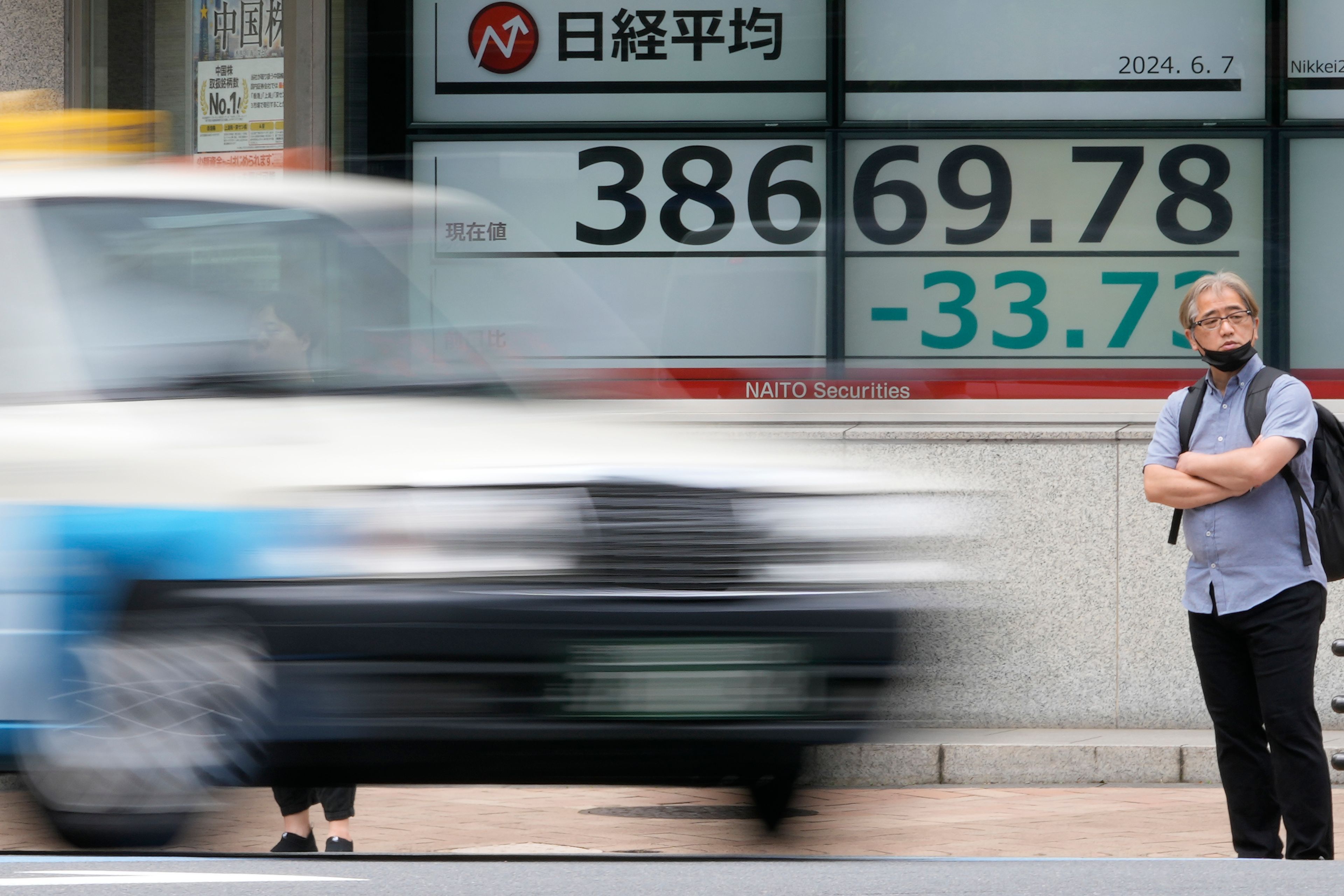 An electronic stock board shows Japan's Nikkei 225 index outside a securities firm Friday, June 7, 2024 in Tokyo.