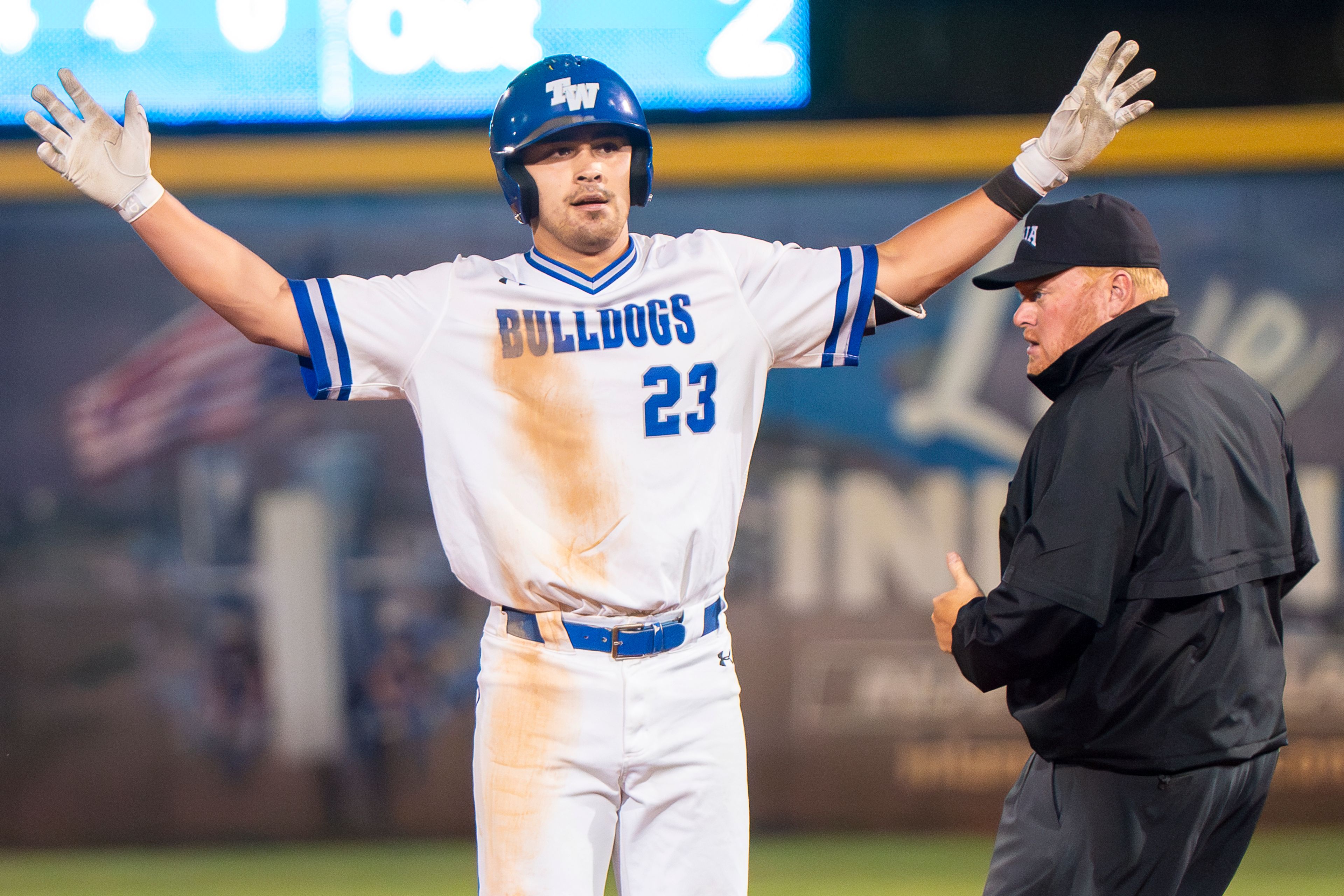 Tennessee Wesleyan’s Jack Stevens (23) celebrates after hitting a double during Game 12 of the NAIA World Series against Georgia Gwinnett on Monday at Harris Field in Lewiston.