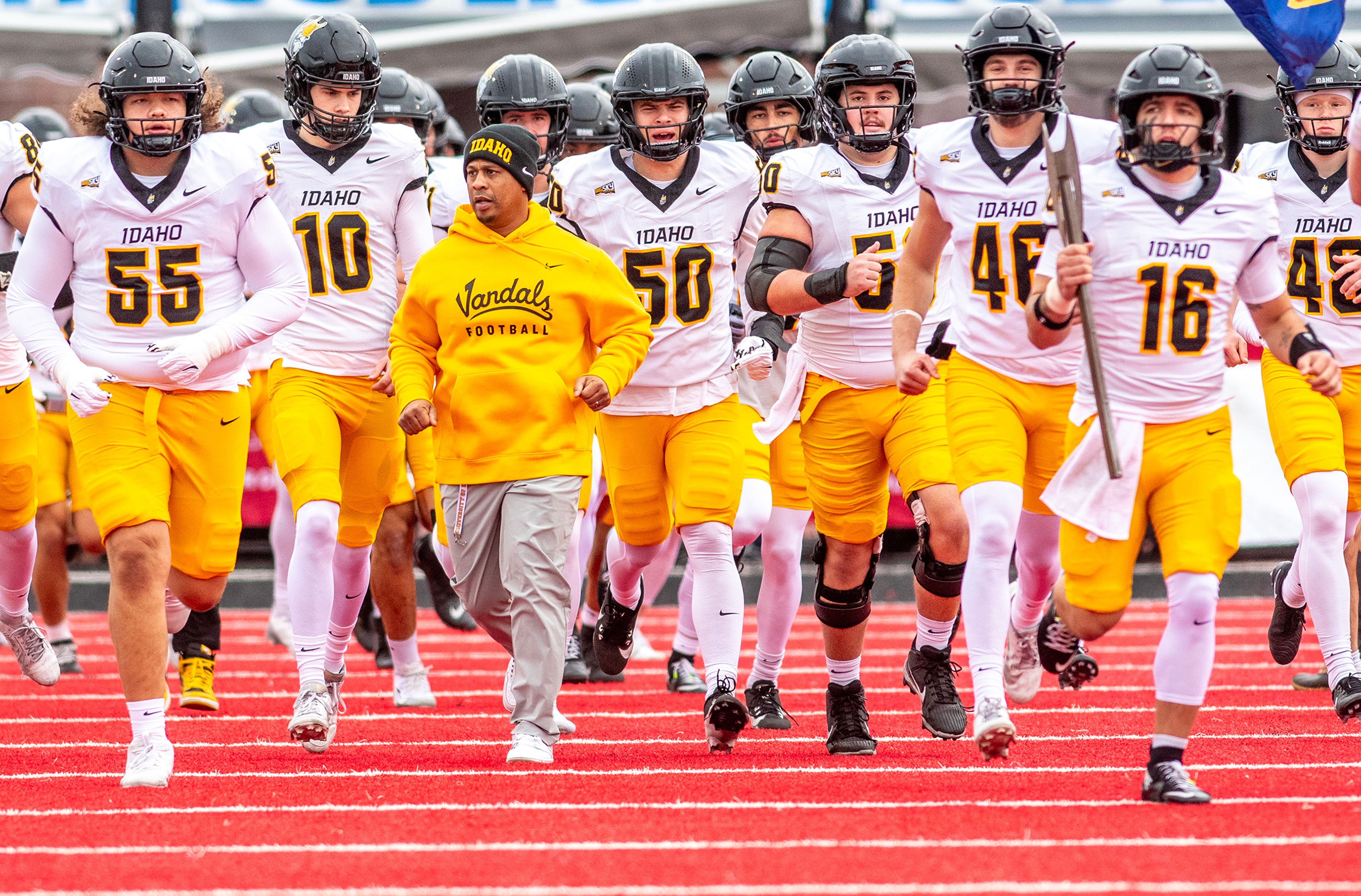 Idaho head coach Thomas Ford Jr. leads the Vandals onto the field to face Eastern Washington during a Big Sky game Oct. 18 at Roos Field in Cheney.