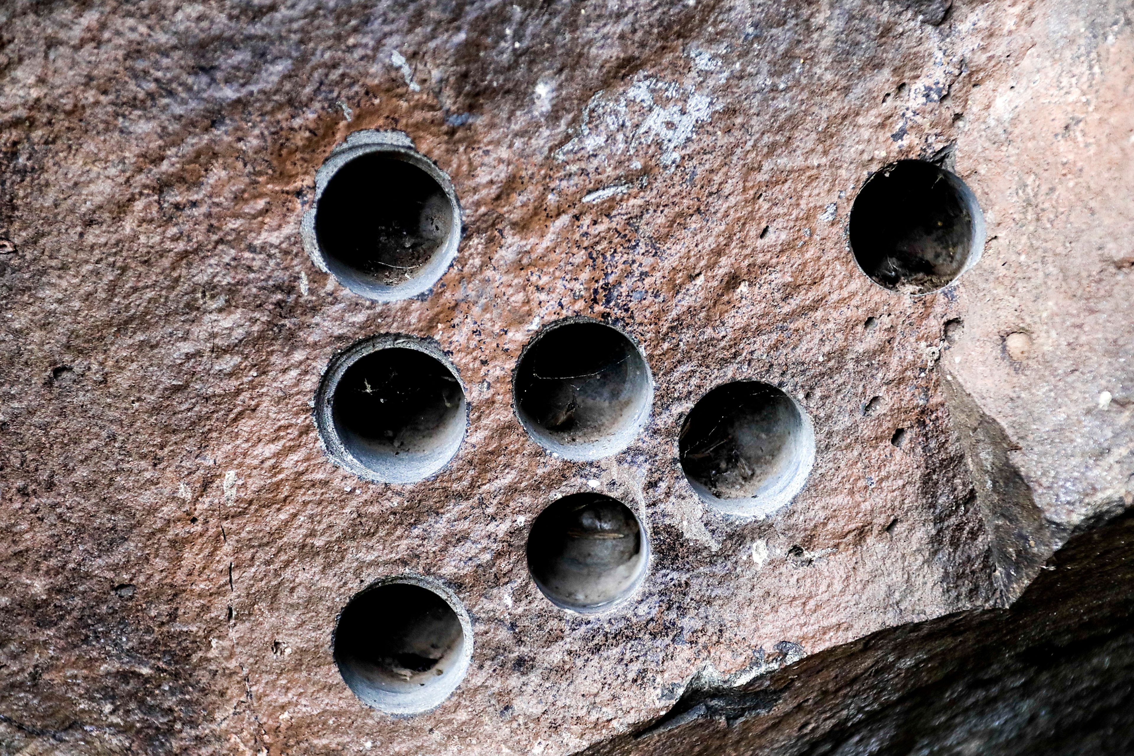 Holes, intended to house dynamite, are seen inside the Hole in the Wall along the Grande Ronde River.