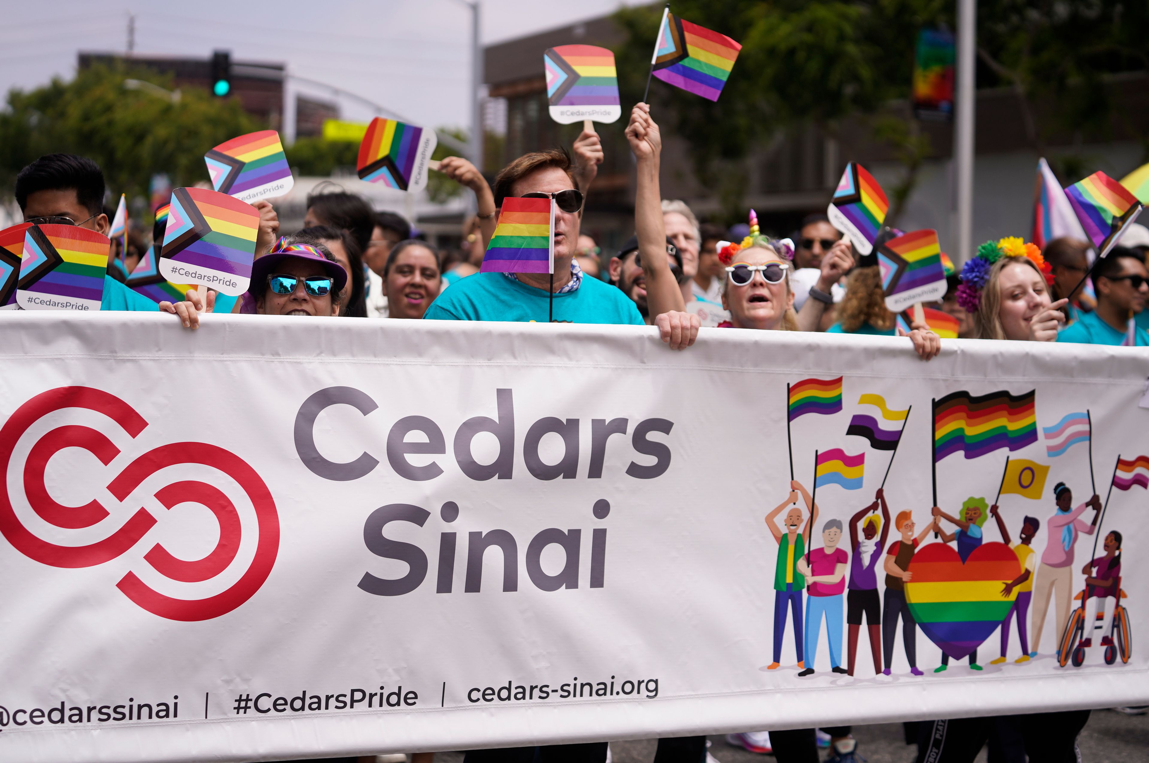 Cedars-Sinai Medical Center members participate at the WeHo Pride Parade in West Hollywood, Calif., on Sunday, June 4, 2023. (AP Photo/Damian Dovarganes)