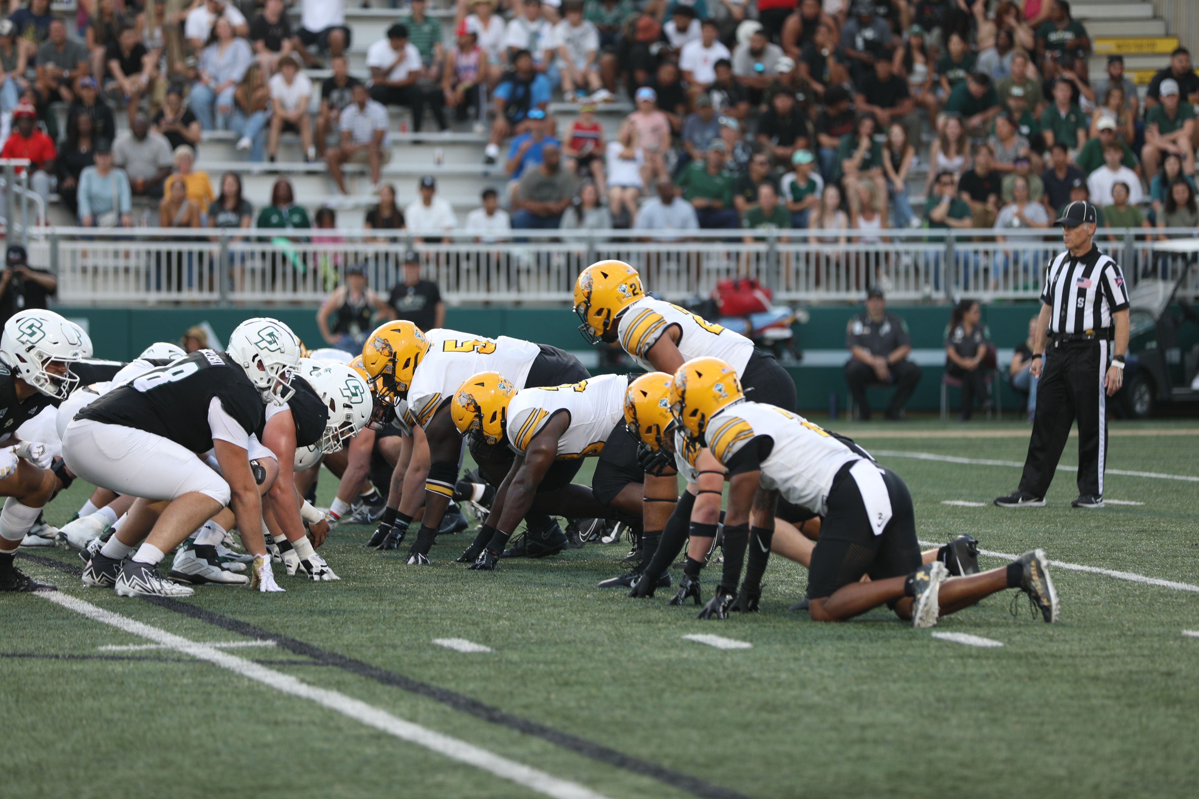 The Idaho defense lines up against the Cal Poly offense during a game Saturday at Mustang Memorial Stadium in San Luis Obispo, Calif.