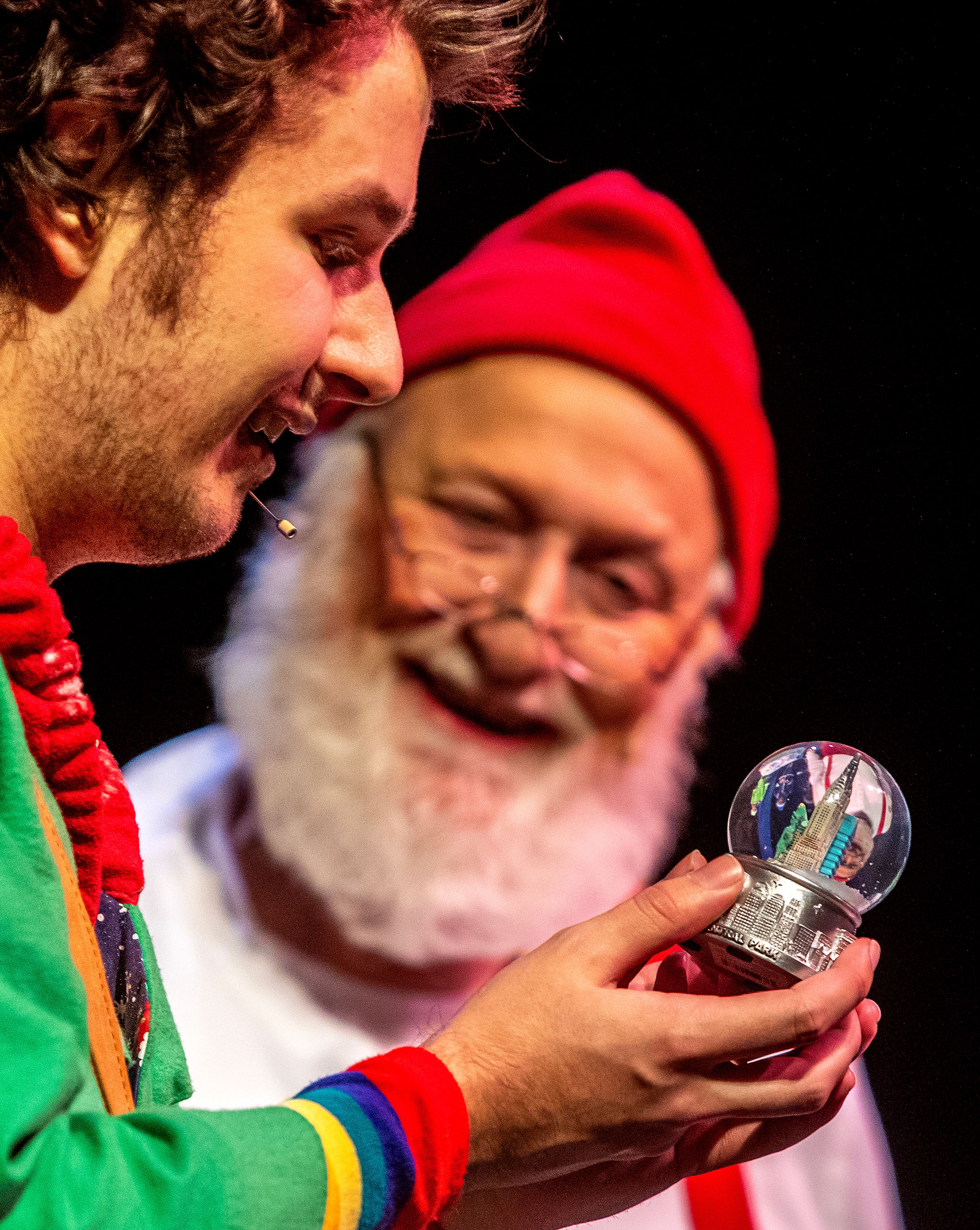 Buddy, played by Alex Everett, receives a snow globe of the Empire State Building from Santa, played by Santa Lew, at a rehearsal for the Civic Theatre production of “Elf” at the old Lewiston High School on Monday.