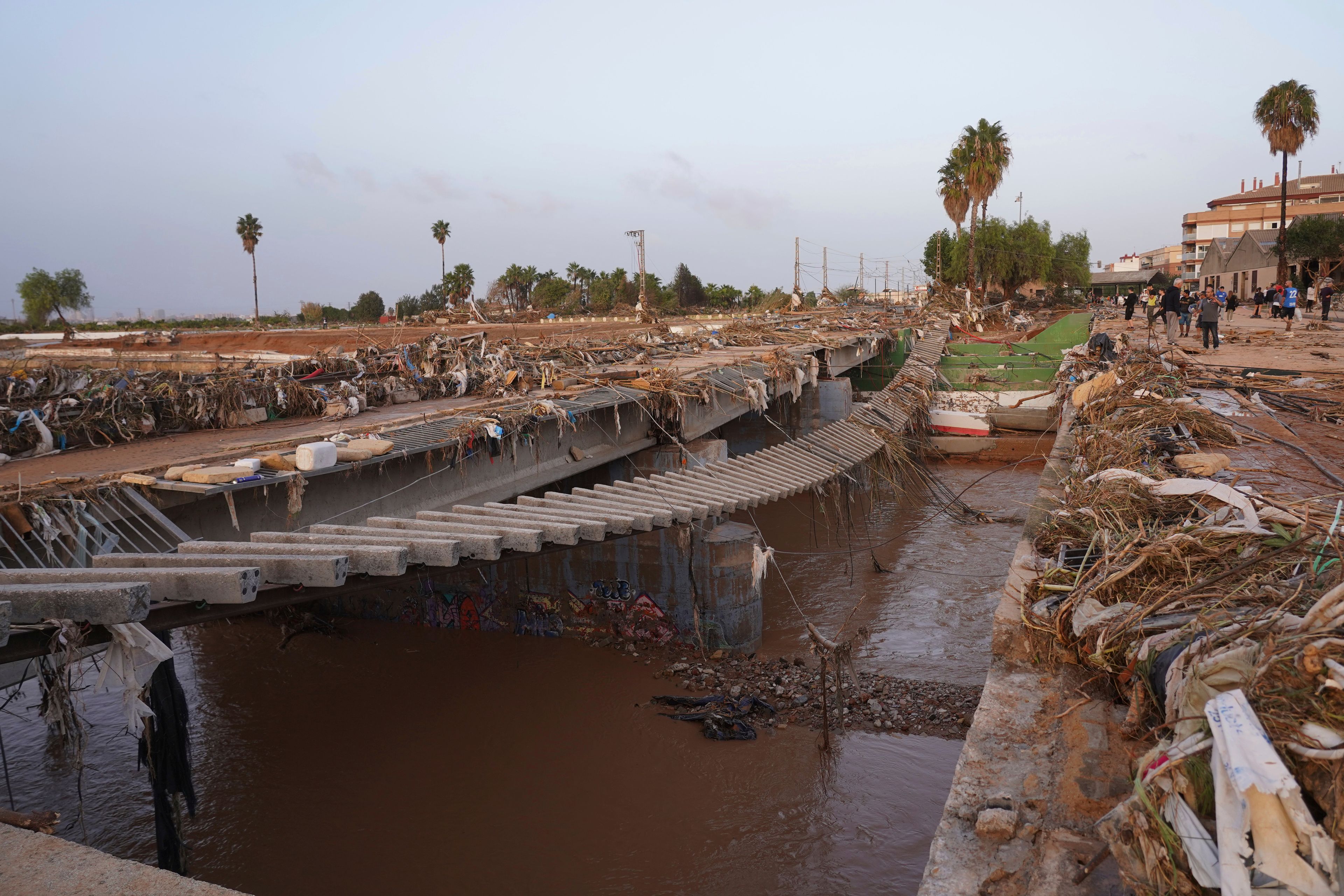 Train tracks are seen affected by floods in Paiporta, near Valencia, Spain, Wednesday, Oct. 30, 2024. (AP Photo/Alberto Saiz)