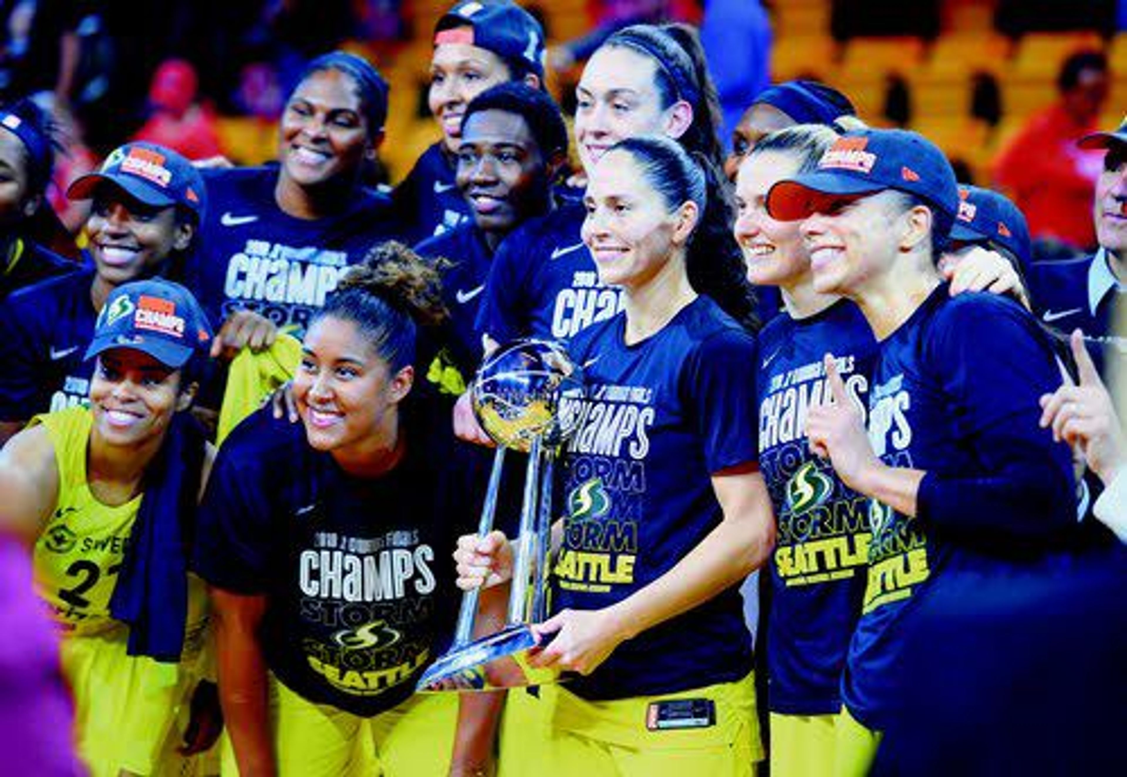 Seattle Storm guard Sue Bird (holding trophy) and her teammates pose with the trophy after winning the WNBA finals against the Washington Mystics. The Storm wrapped up the series with a 98-82 victory Wednesday evening.