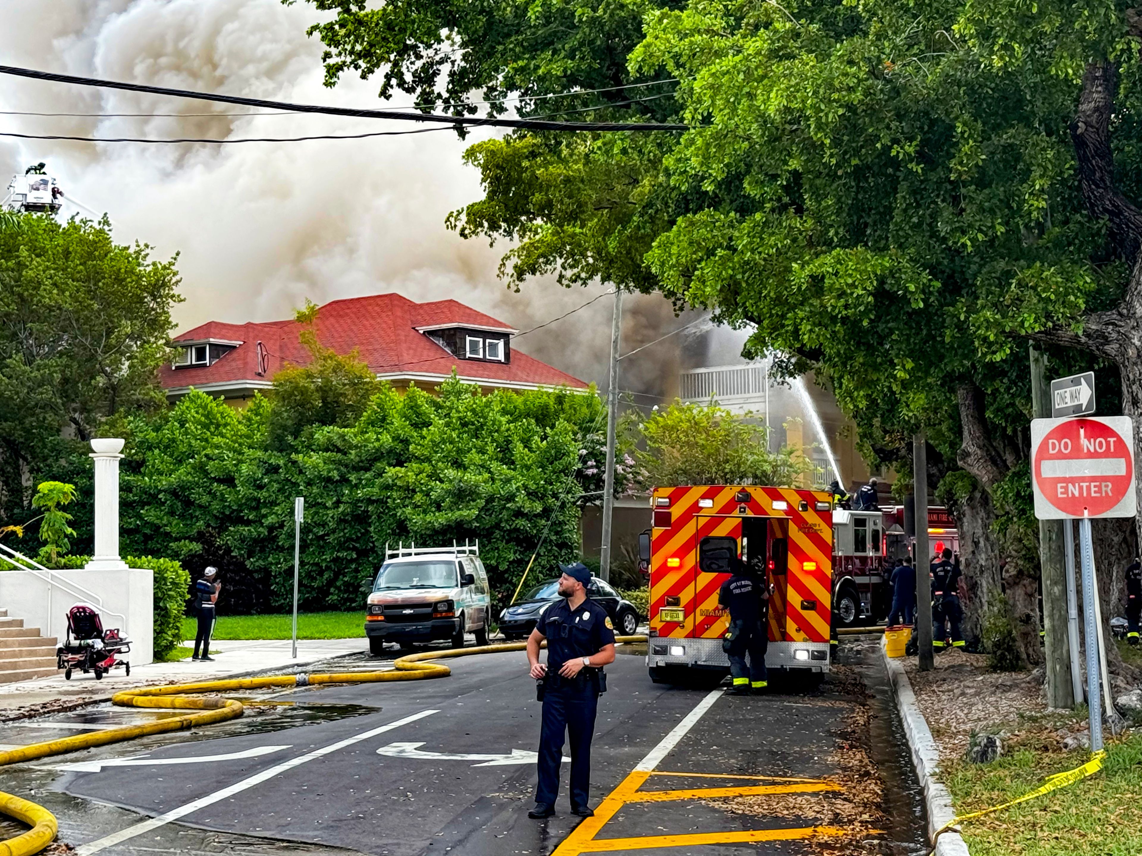 Miami Fire Rescue and Miami police work at the scene of the fire at the Temple Court Apartments, Monday, June 10, 2024 in Miami.