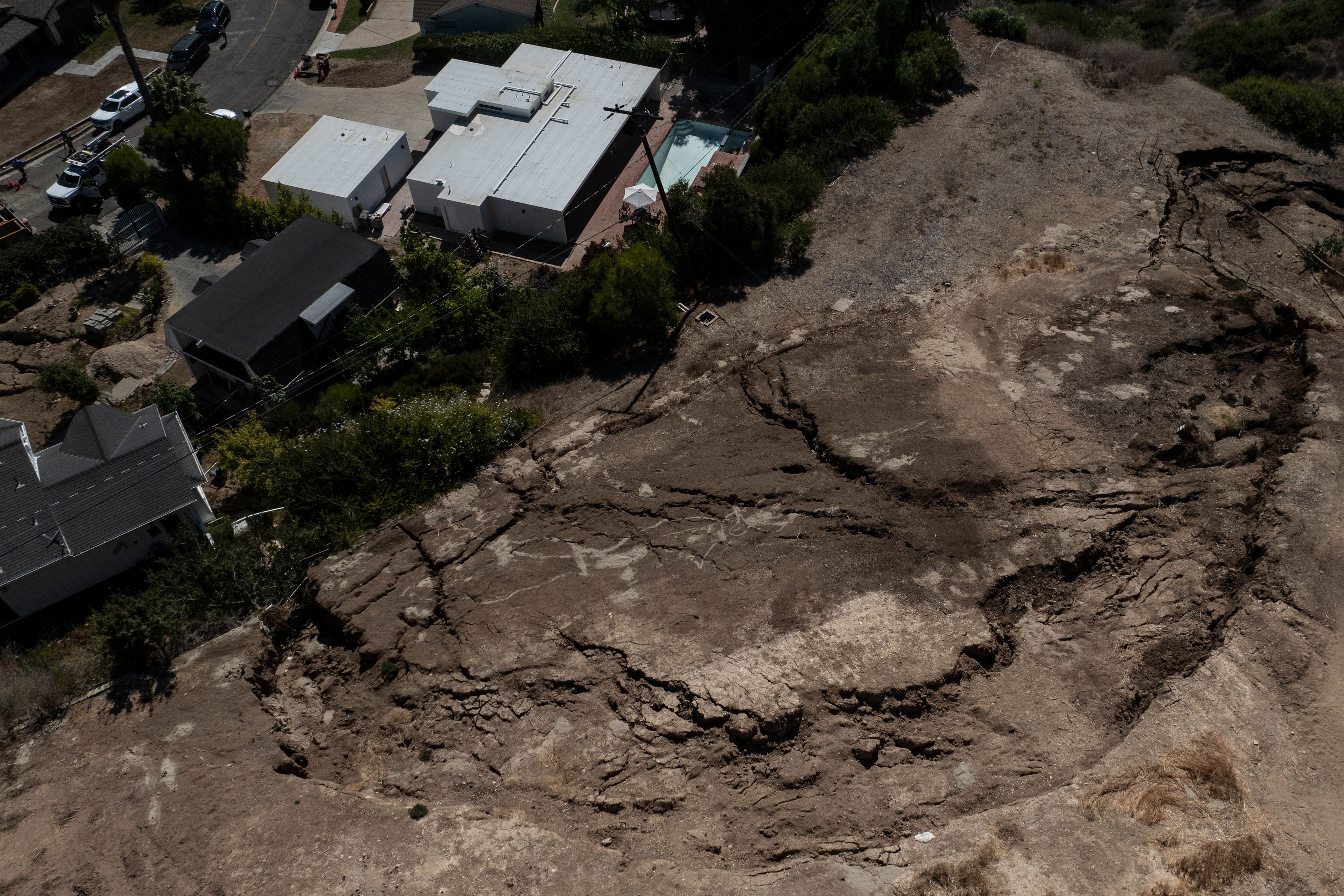 An aerial view shows a neighborhood affected by ongoing landslides in Rancho Palos Verdes, Calif., Tuesday, Sept. 3, 2024.