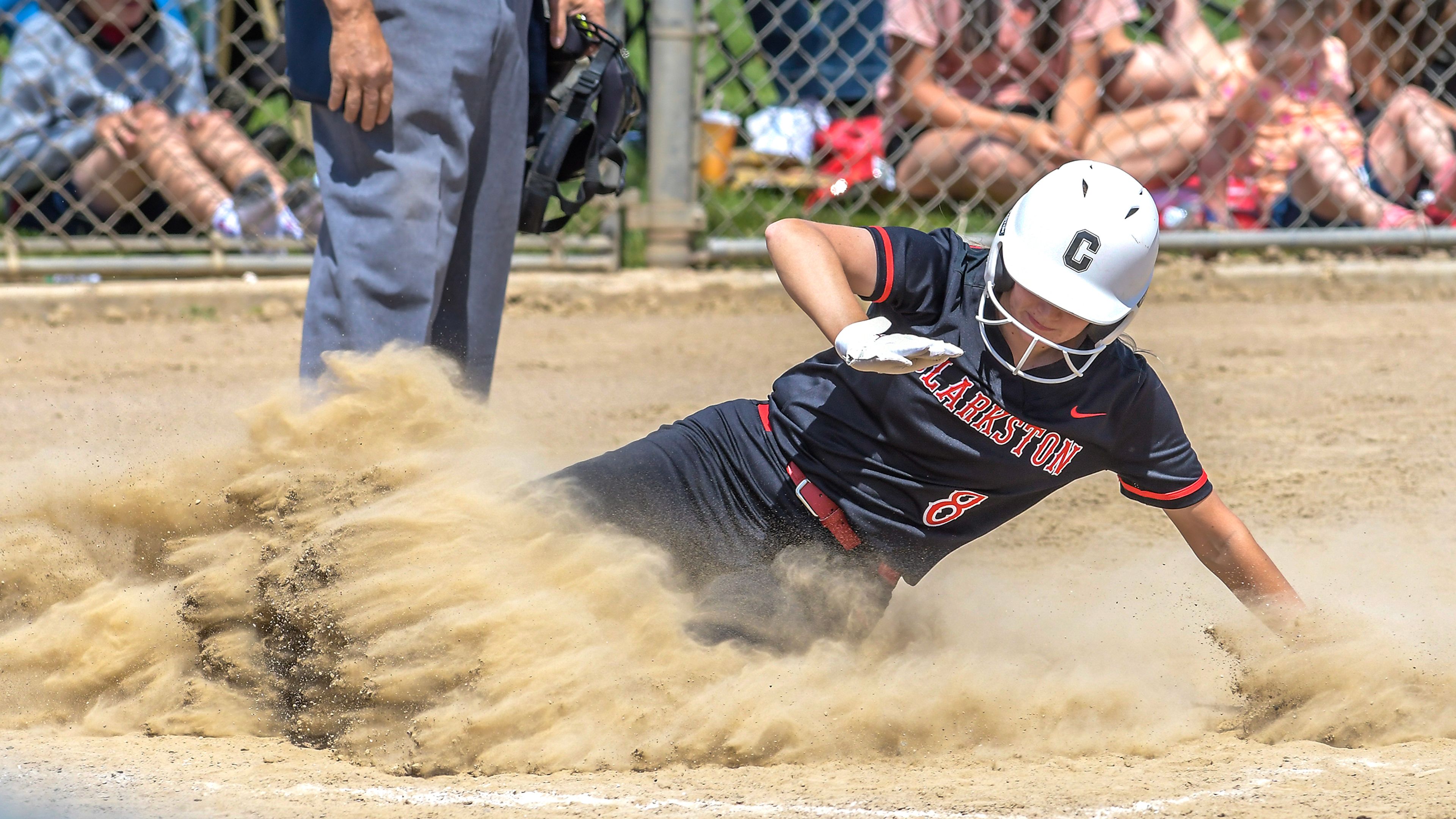 Clarkston’s Joey Miller slides into home to score a run against Shadle Park during an inning of the District Championship Game Saturday in Clarkston.