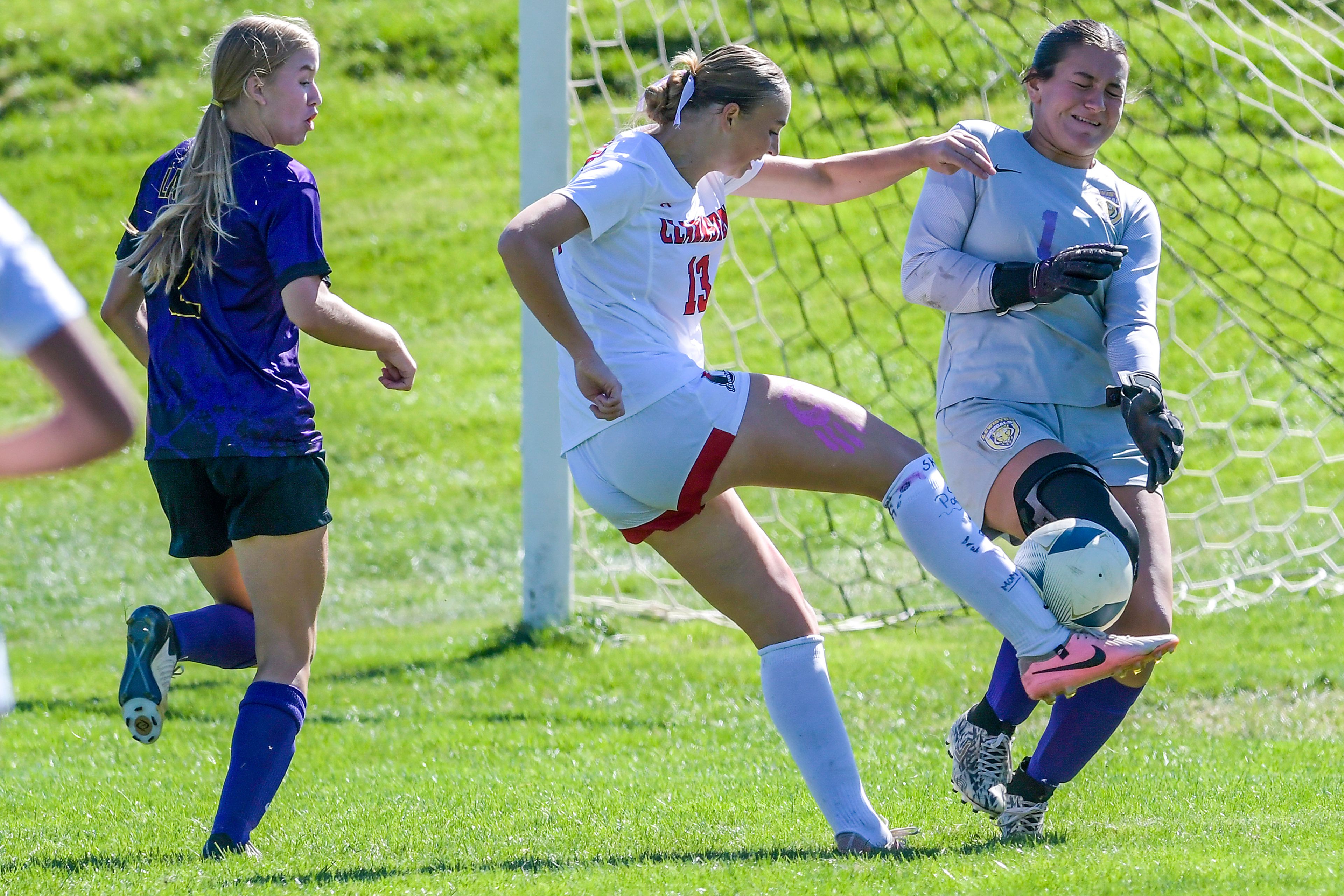 Clarkston�s Rebecca Skinner hits the ball as Lewiston goalkeeper Solana Inzunza blocks it during a nonconference game Sept. 21 at Walker Field in Lewiston.