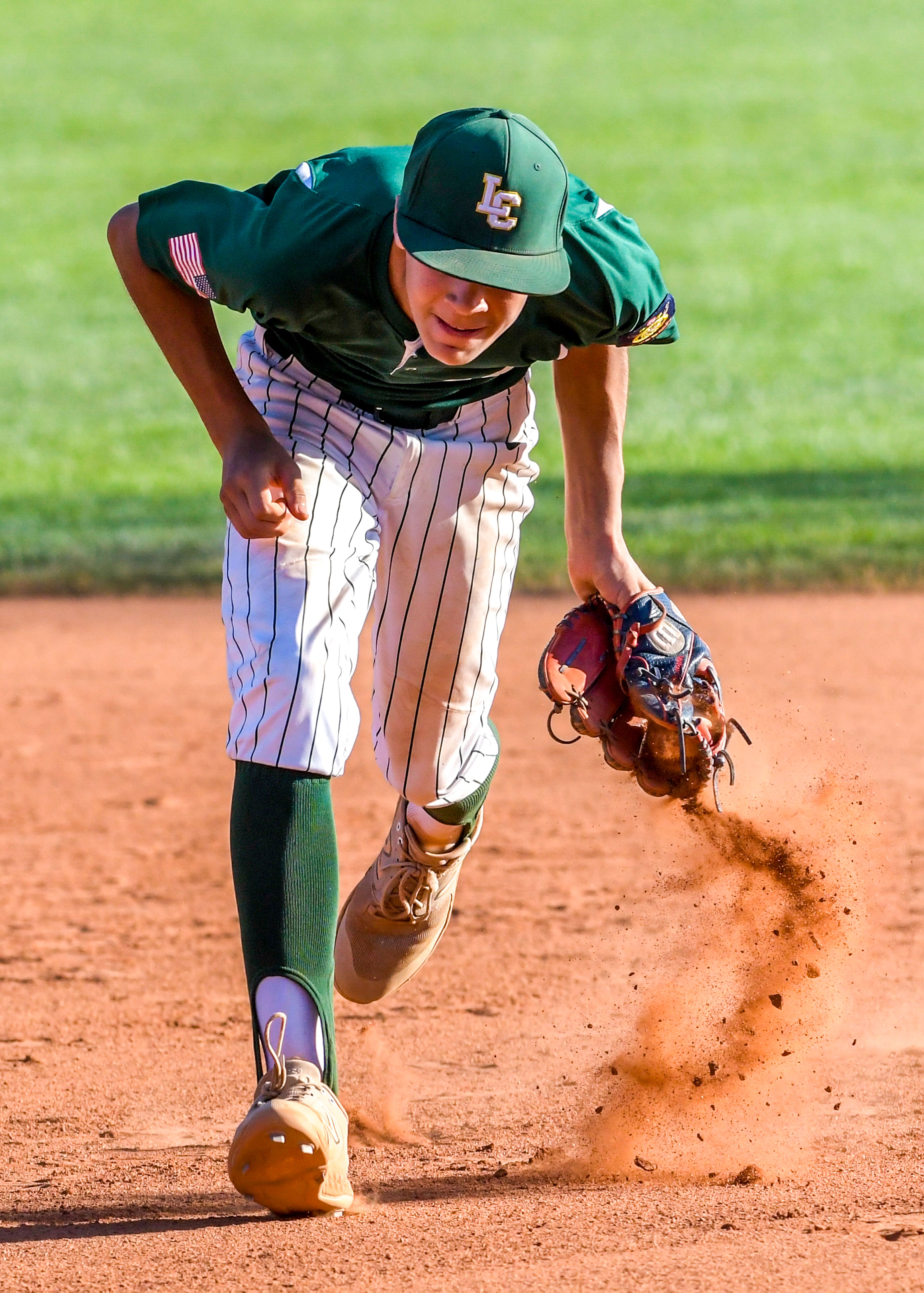 Lewis-Clark Cubs second baseman Zavier McFee grabs a ground ball against the Blue Devils in a game of the Clancy Ellis Tournament on Saturday at Harris Field in Lewiston.