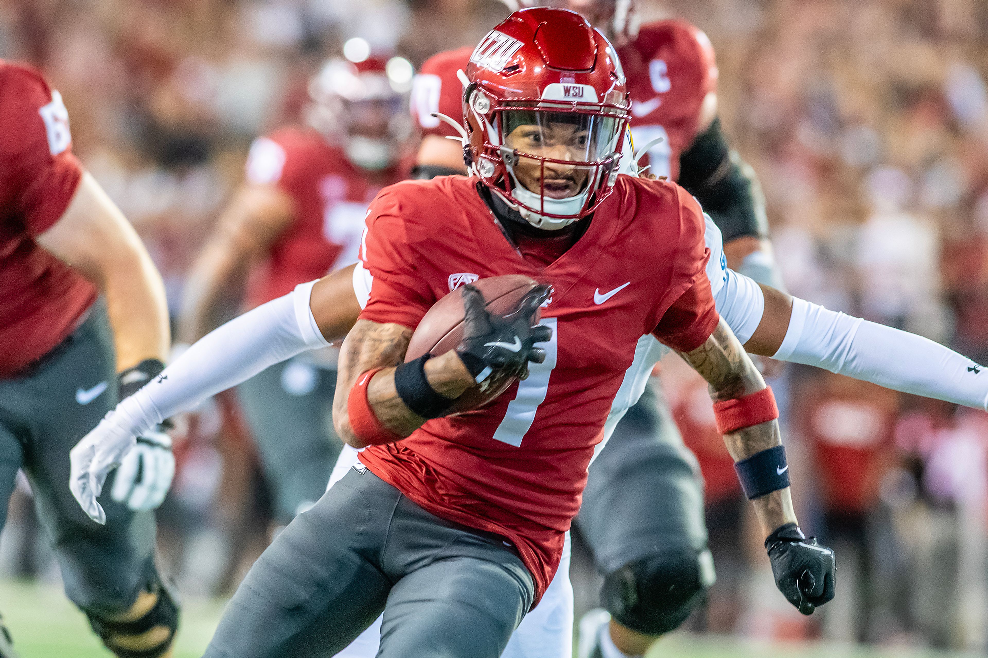 Washington State wide receiver Kris Hutson runs the ball against San Jose State during a game Friday, Sept. 20, at Gesa Field in Pullman.,