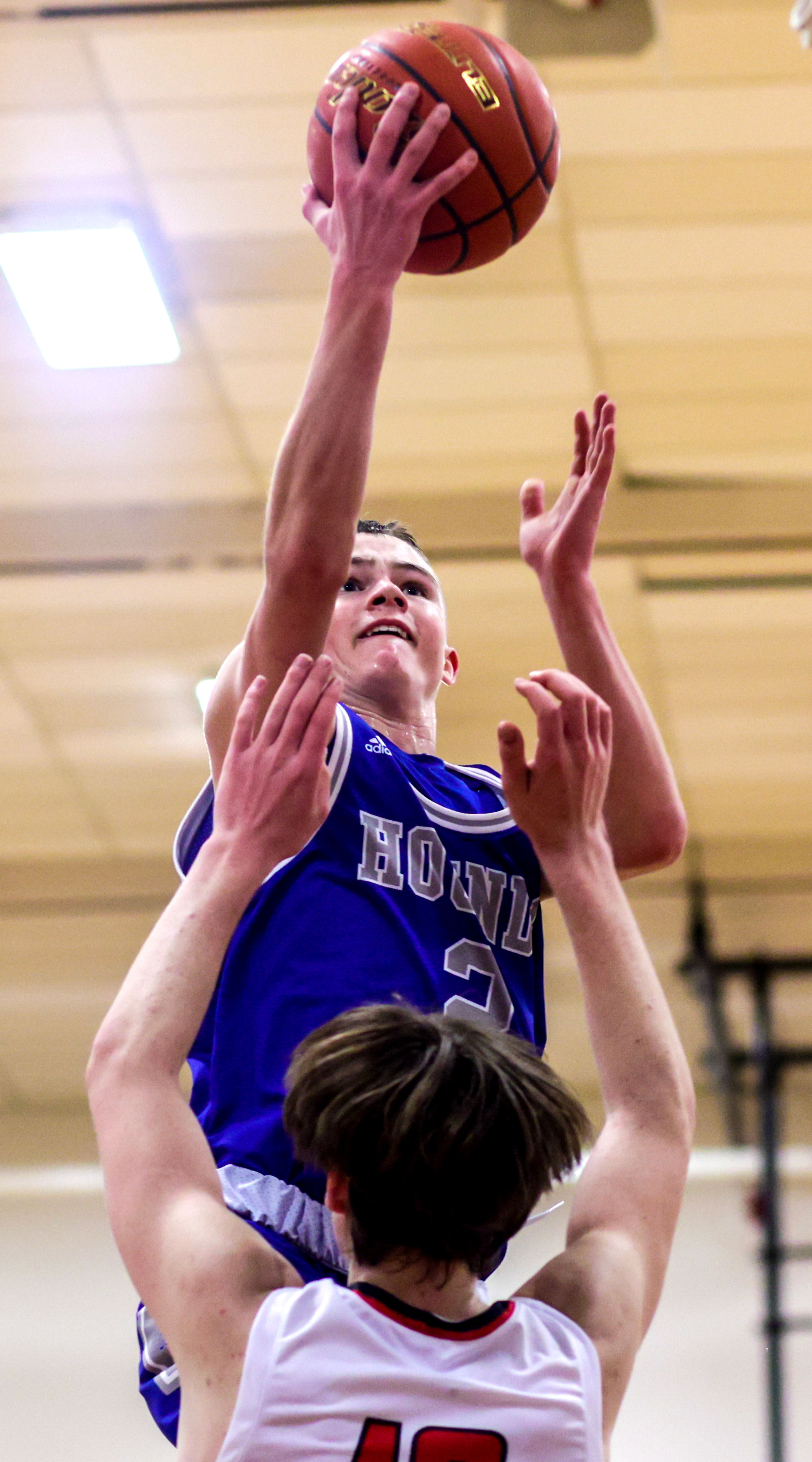 Pullman point guard Jaedyn Brown shoots the ball as Clarkston forward Carter Steinwand defends during Tuesday's Class 2A Greater Spokane League boys basketball game.