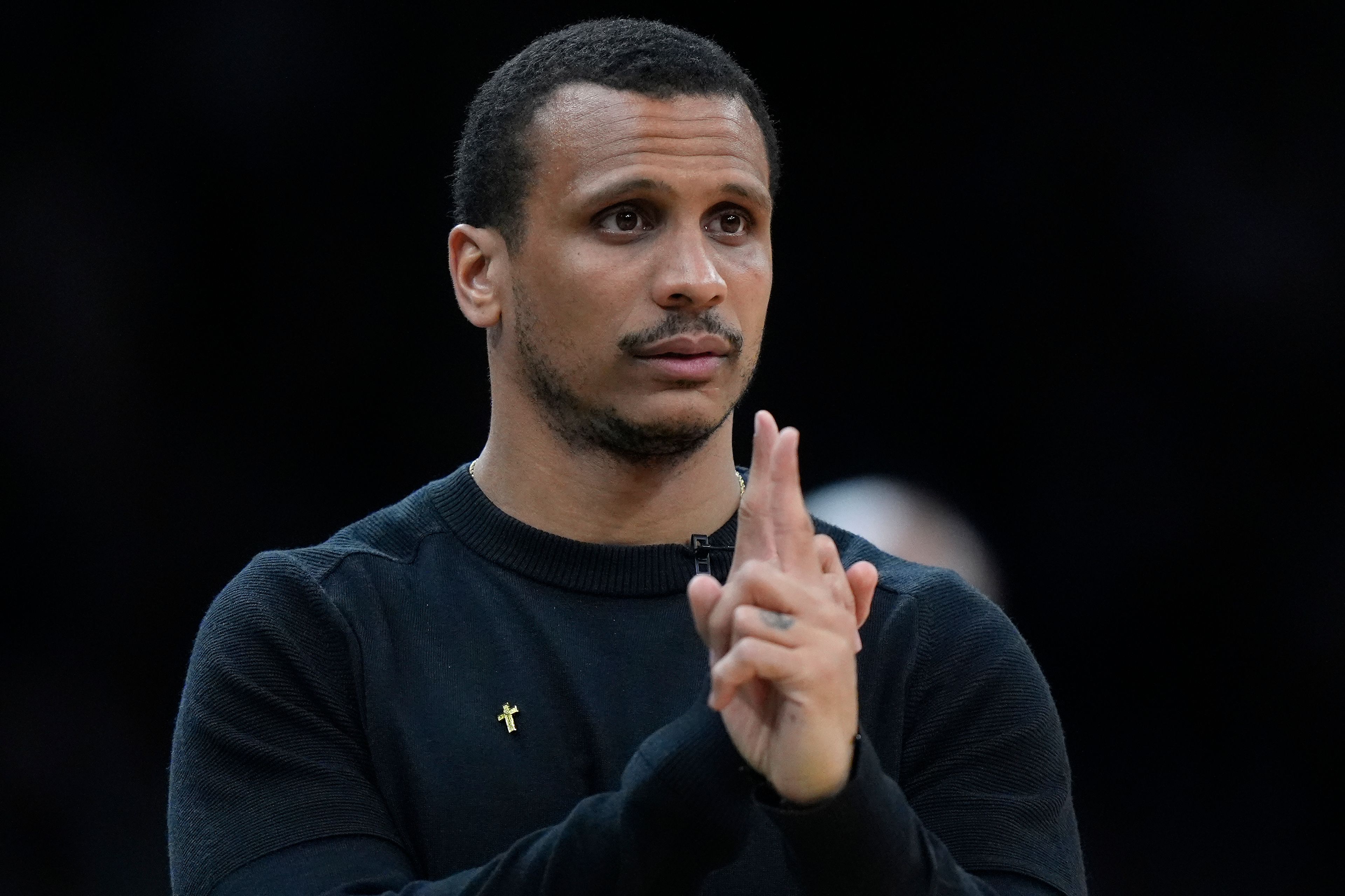 Boston Celtics coach Joe Mazzulla signals to players from the bench during the second half of Game 2 of an NBA basketball second-round playoff series against the Cleveland Cavaliers, Thursday, May 9, 2024, in Boston. (AP Photo/Steven Senne)