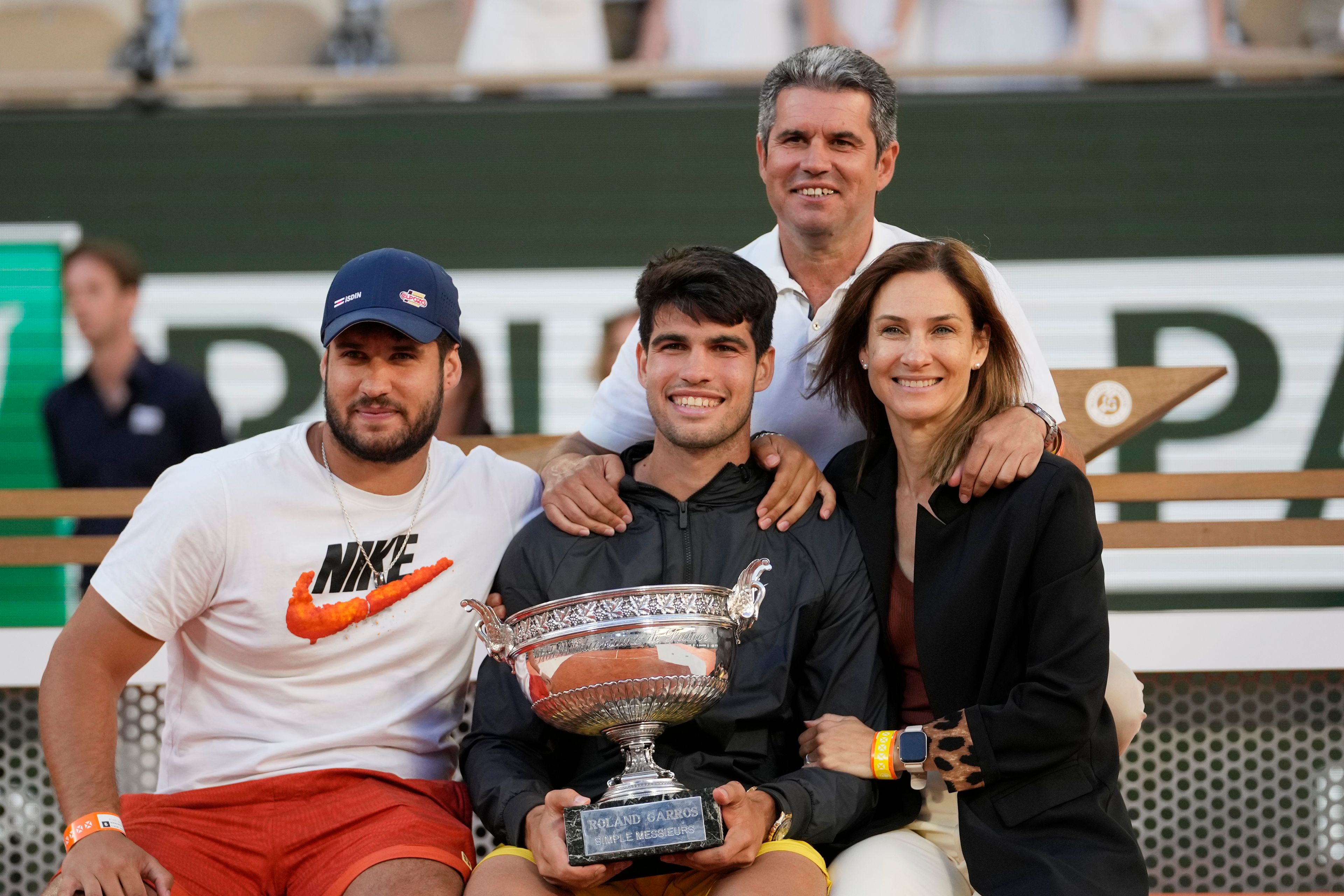 Winner Spain's Carlos Alcaraz poses for a picture with his mother Virginia Garfia Escandon, right, father Carlos Alcaraz Gonzalez, top, and brother Alvaro Alcaraz after the men's final match of the French Open tennis tournament against Germany's Alexander Zverev at the Roland Garros stadium in Paris, Sunday, June 9, 2024.